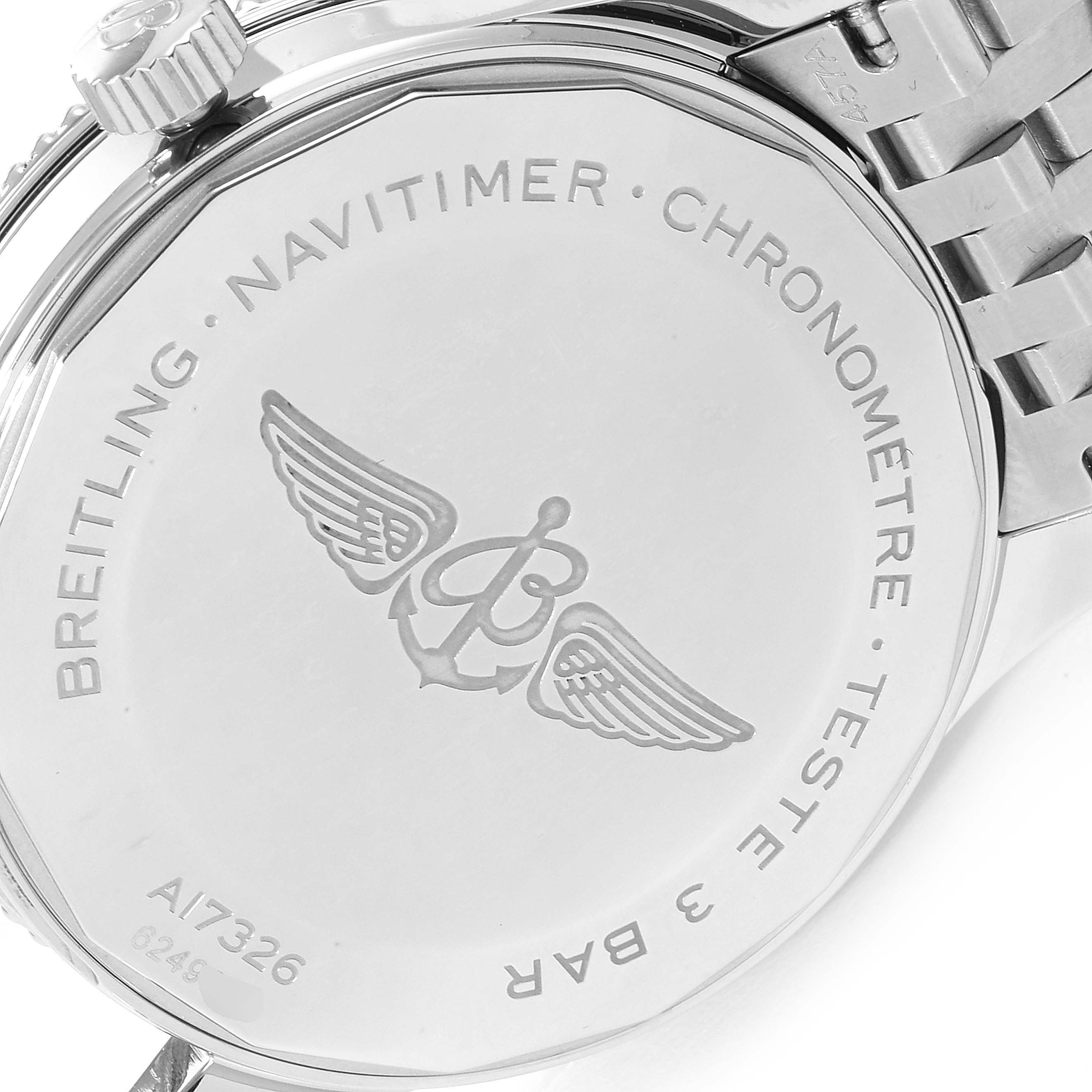 The image shows the back of a Breitling Navitimer A17326 Men
s Stainless Steel Silver Dial A17326 Men
s Stainless Steel Silver Dial watch, featuring engraved branding and winged logo details.