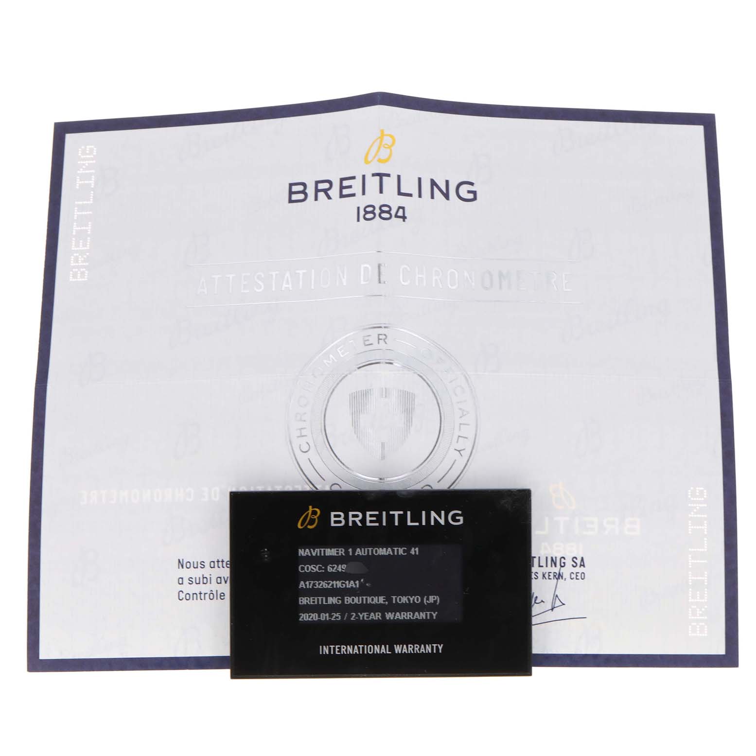 The image shows the warranty card and certificate for a Breitling Navitimer A17326 Men
s Stainless Steel Silver Dial A17326 Men
s Stainless Steel Silver Dial watch at a flat angle.