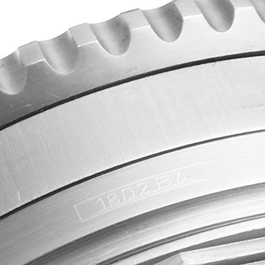 This image shows a close-up of the bezel and part of the case of a Breitling Navitimer A41322 Men
s Stainless Steel Black Dial A41322 Men
s Stainless Steel Black Dial watch.