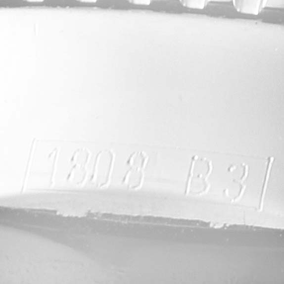 The image shows a close-up, angled view of the Breitling Superocean A17320 Men
s Stainless Steel Black Dial A17320 Men
s Stainless Steel Black Dial model
s bezel with engraving "1803 B3."