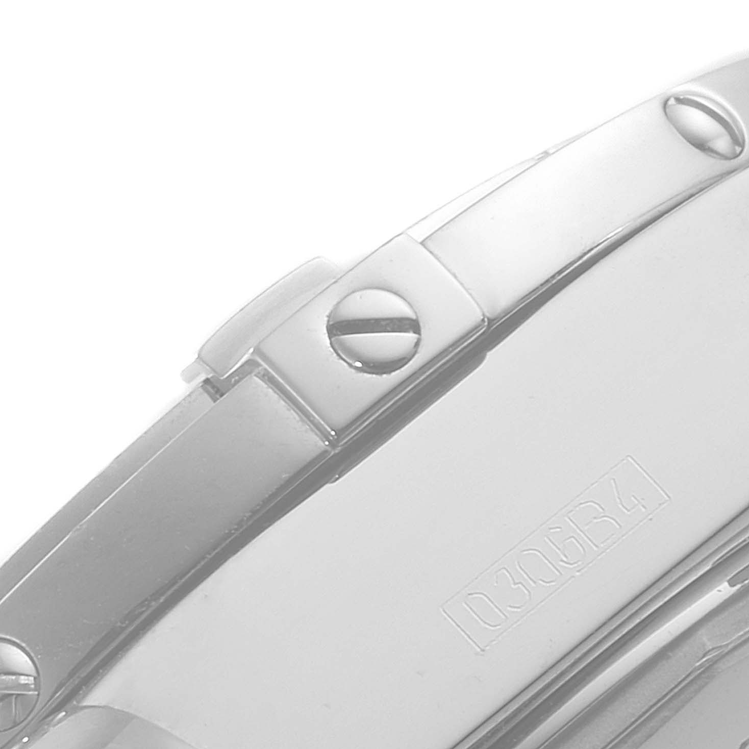 The image shows a close-up of the side view of a Breitling Galactic A49350 Men's Stainless Steel Silver Dial A49350 Men's Stainless Steel Silver Dial watch, highlighting the bezel screws and the serial number.