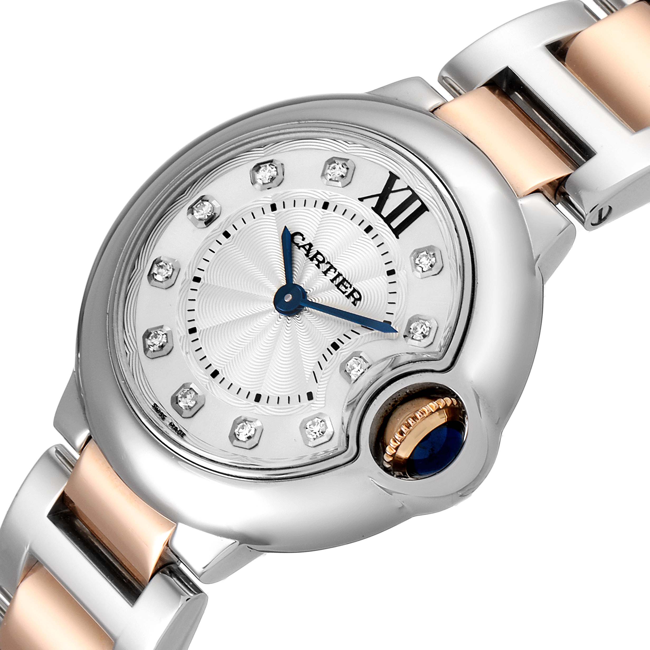The image shows a close-up angle of a Cartier Ballon Bleu WE902030 Women
s Steel and Gold (two tone) Silver Dial WE902030 Women
s Steel and Gold (two tone) Silver Dial watch highlighting the dial and part of the bracelet.