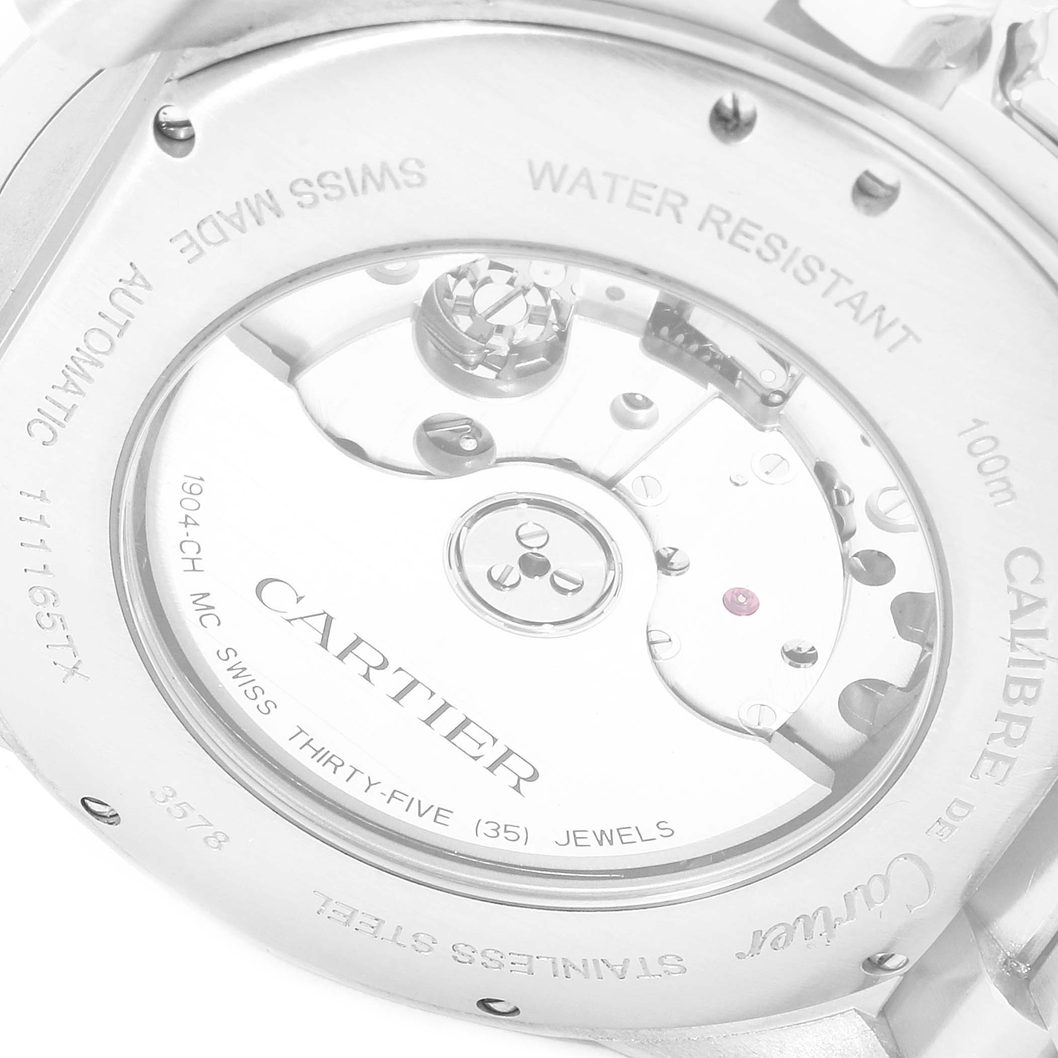 This image shows the back case of a Calibre de Cartier watch by Cartier, highlighting the automatic movement and inscriptions.