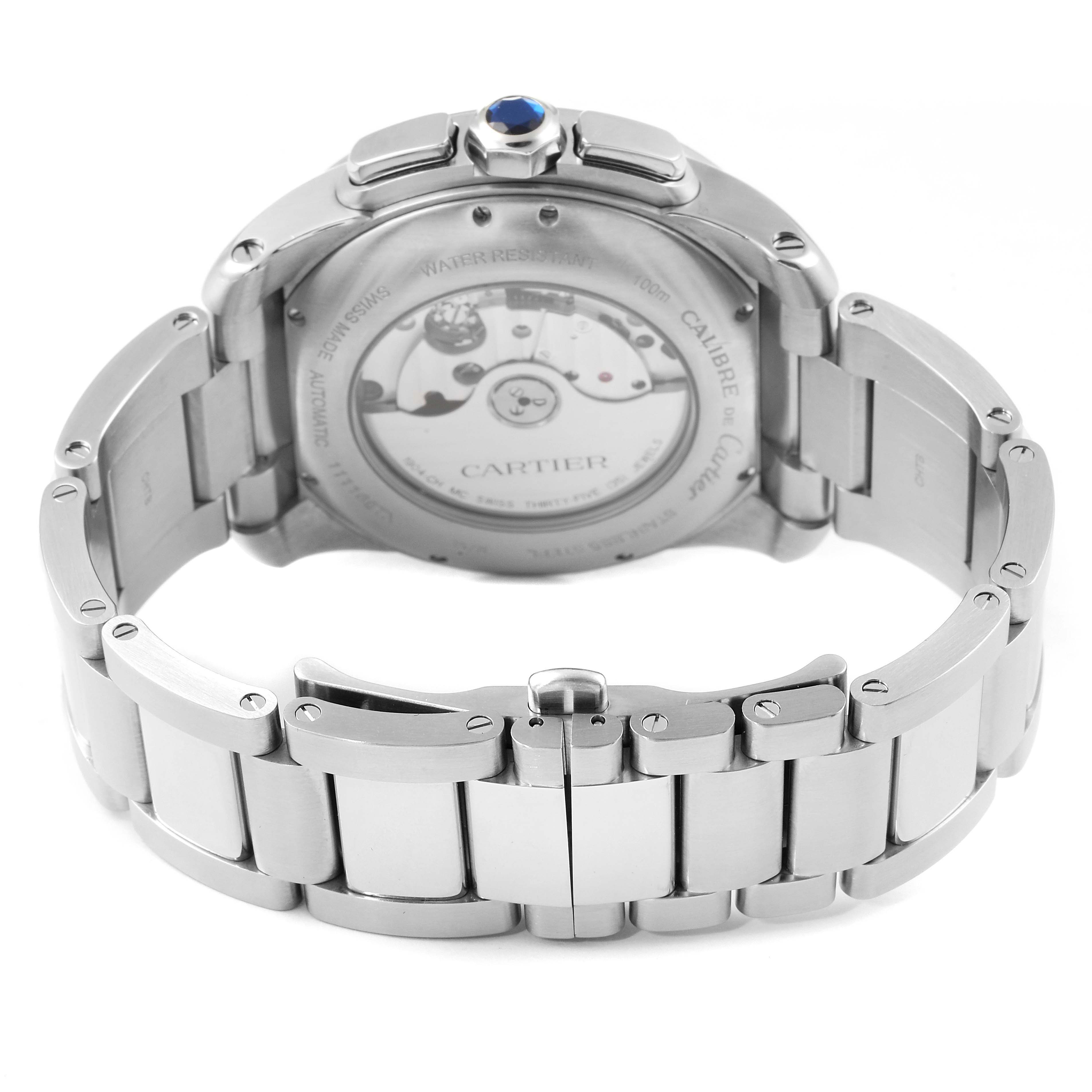 This image shows the back view of a Calibre de Cartier watch by Cartier, highlighting the movement and metal bracelet.