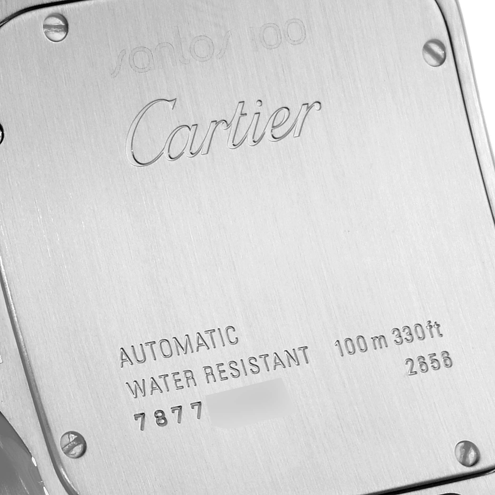 The image shows the back case of a Santos model watch by Cartier, displaying engraved details like water resistance and model numbers.