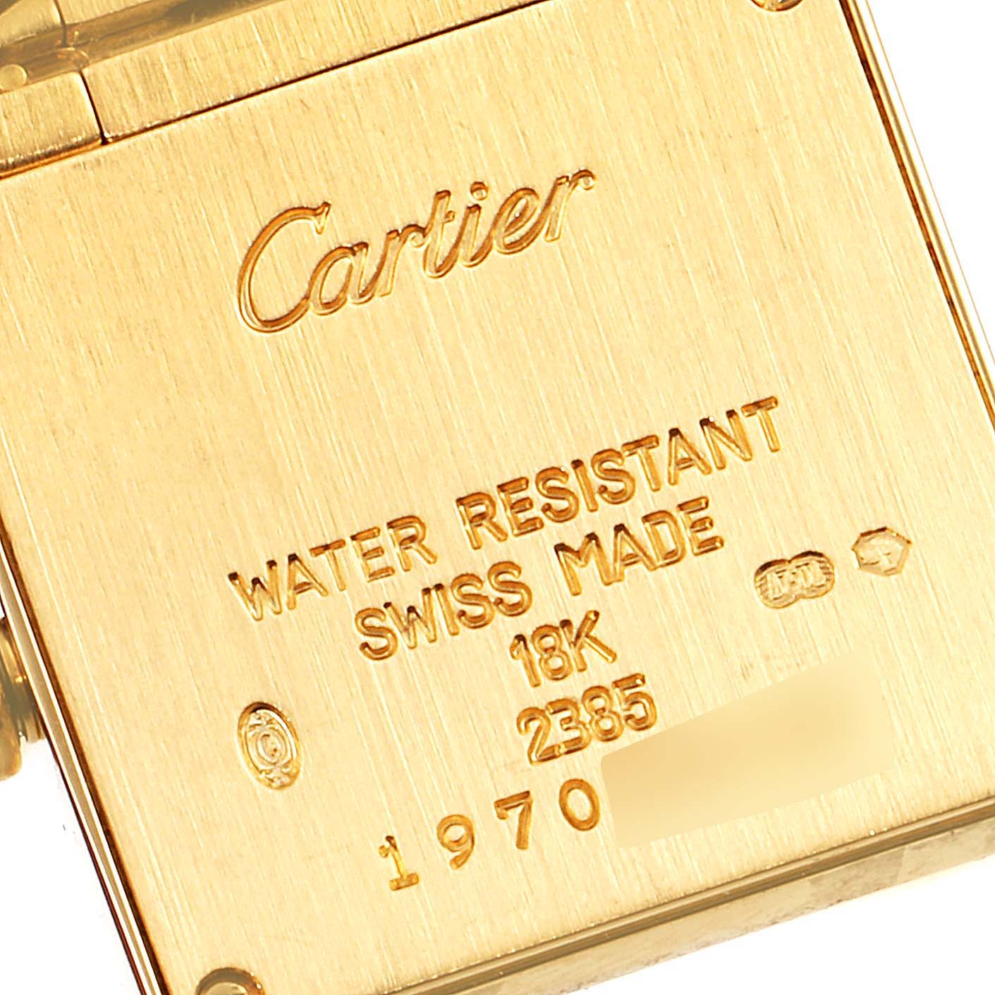 The image shows the back of a Cartier Tank Francaise W50002N2 Women's Yellow Gold Silver Dial W50002N2 Women's Yellow Gold Silver Dial watch with engravings indicating specifications.