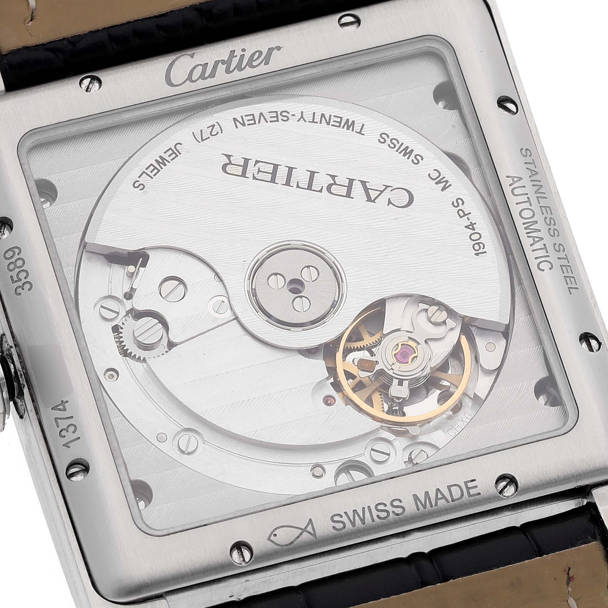 The image shows the transparent back of a Cartier Tank MC WSTA0010 Men's Stainless Steel Blue Dial WSTA0010 Men's Stainless Steel Blue Dial watch, revealing its automatic movement mechanism.