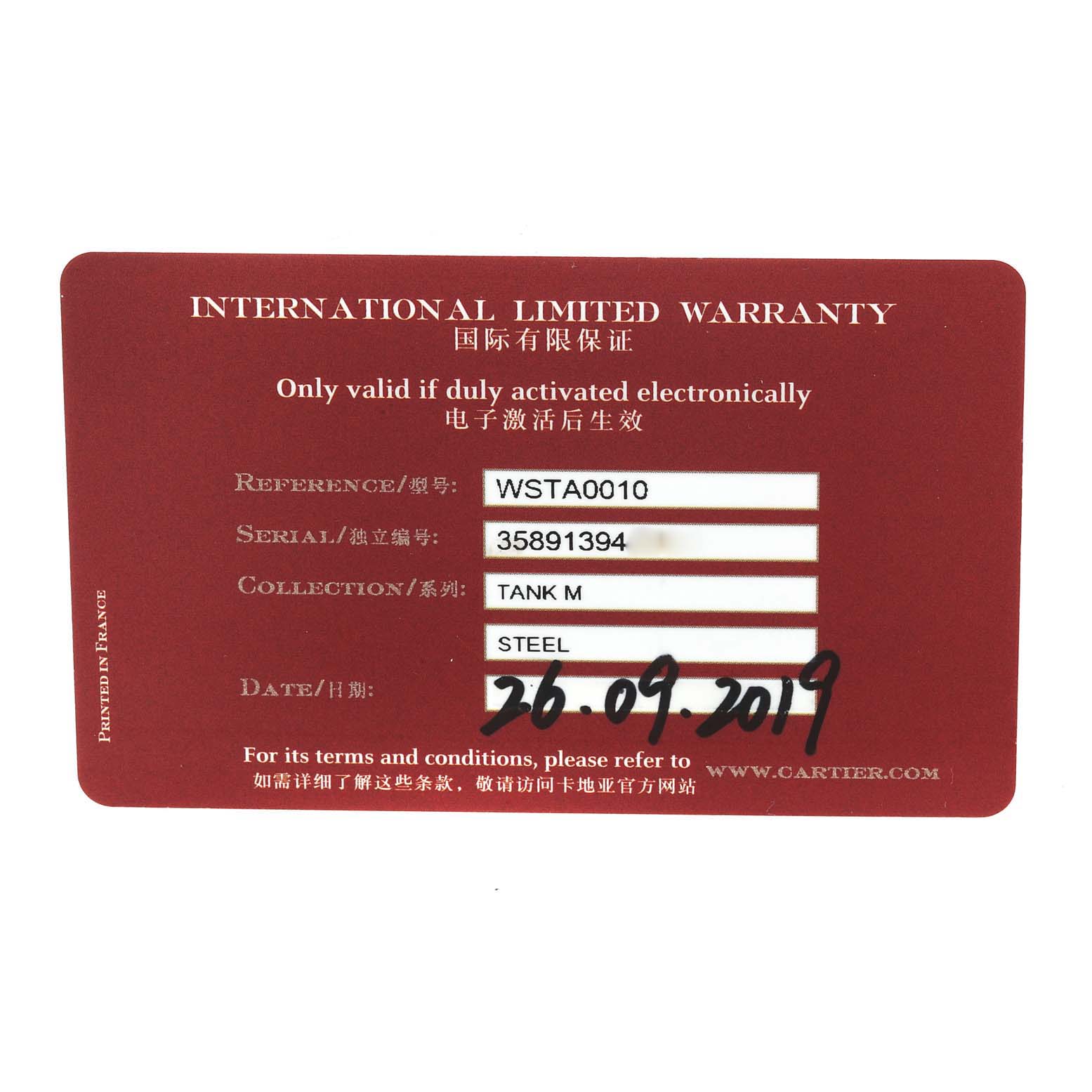 This image shows an international limited warranty card for the Cartier Tank MC WSTA0010 Men's Stainless Steel Blue Dial WSTA0010 Men's Stainless Steel Blue Dial watch, detailing its reference and serial number.
