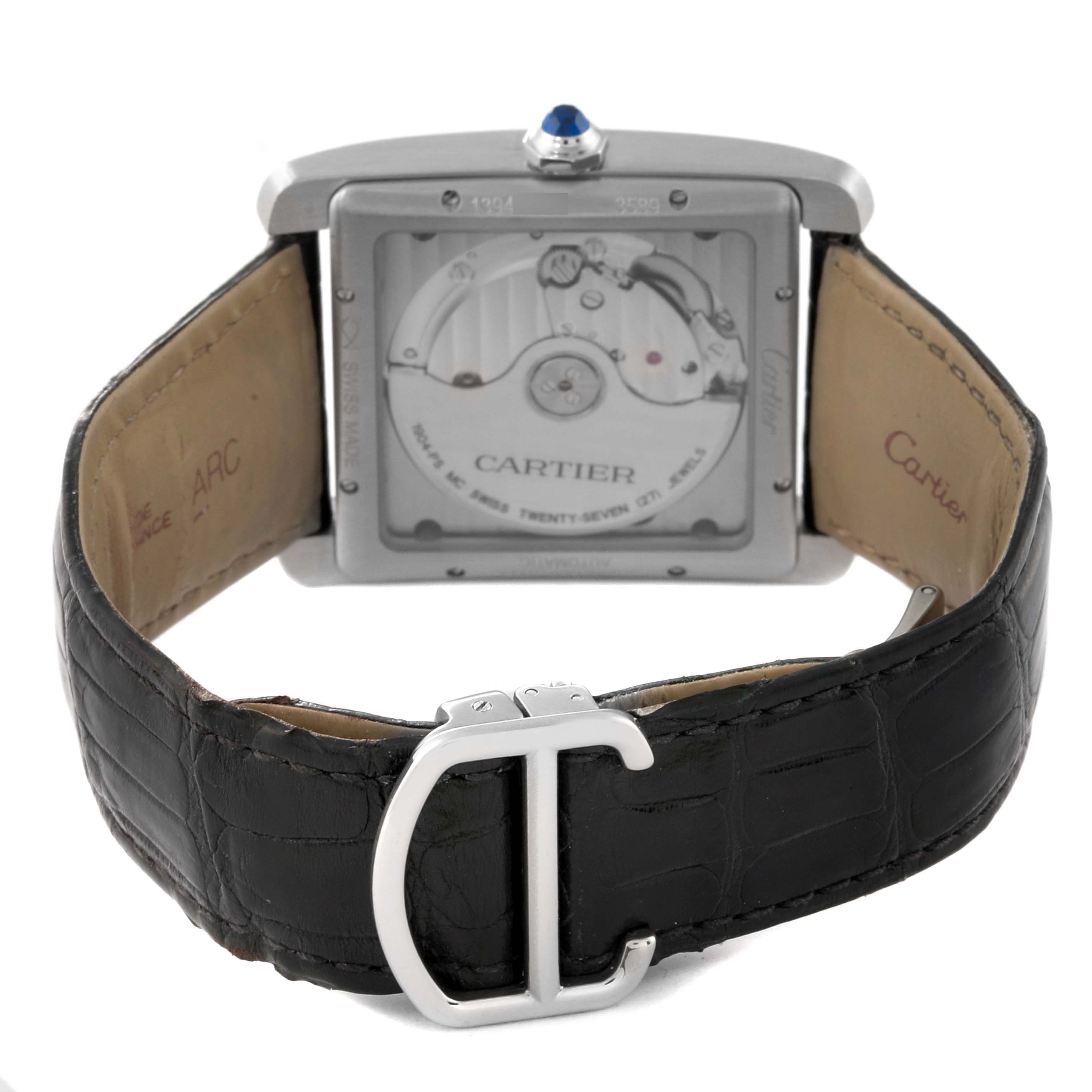 The image shows the back view of the Cartier Tank MC WSTA0010 Men's Stainless Steel Blue Dial WSTA0010 Men's Stainless Steel Blue Dial model watch, highlighting its mechanical movement and leather strap with a buckle.