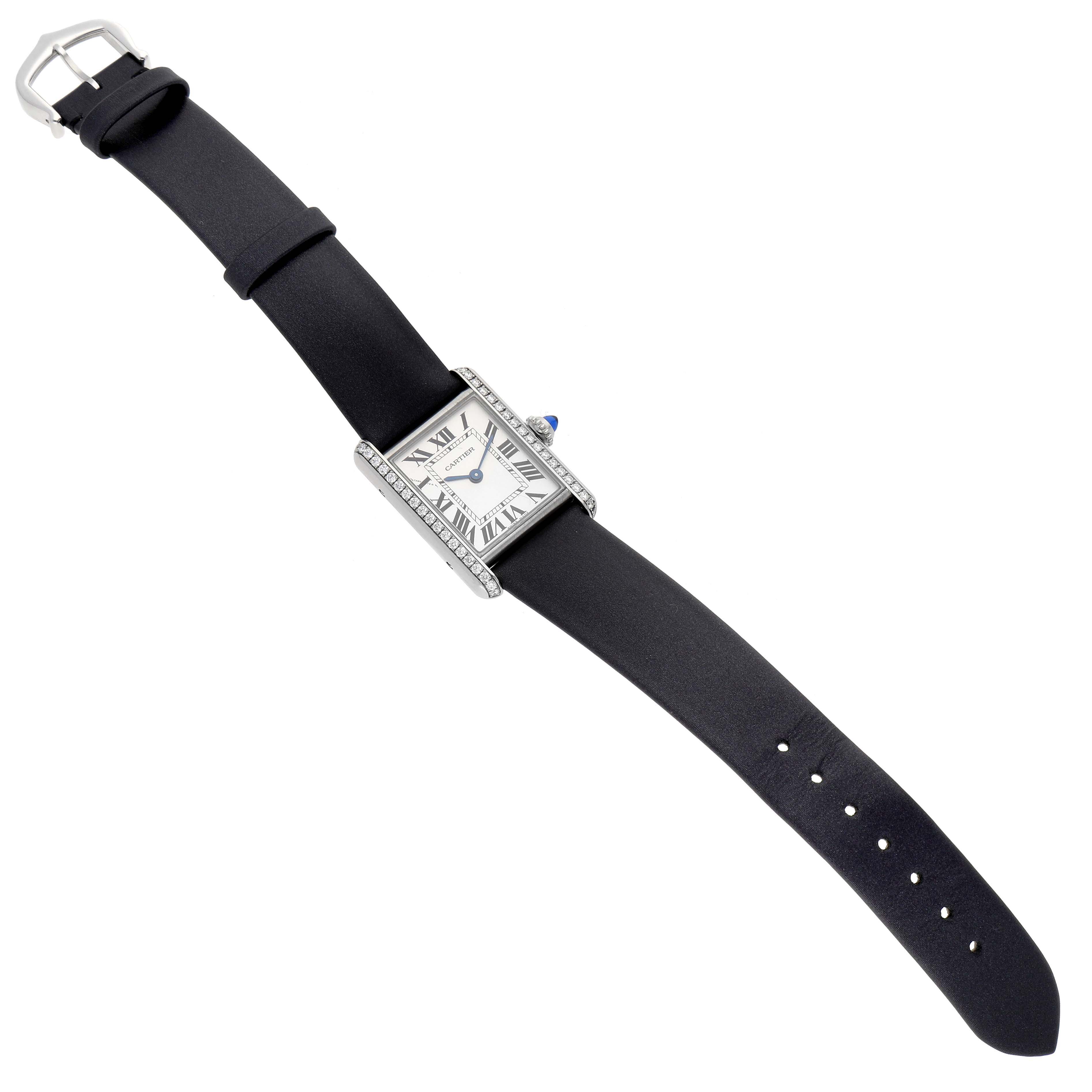 The image shows a top-down view of a Cartier Tank Must W4TA0016 Women's Stainless Steel Silver Dial W4TA0016 Women's Stainless Steel Silver Dial model watch, displaying the face, strap, and buckle.