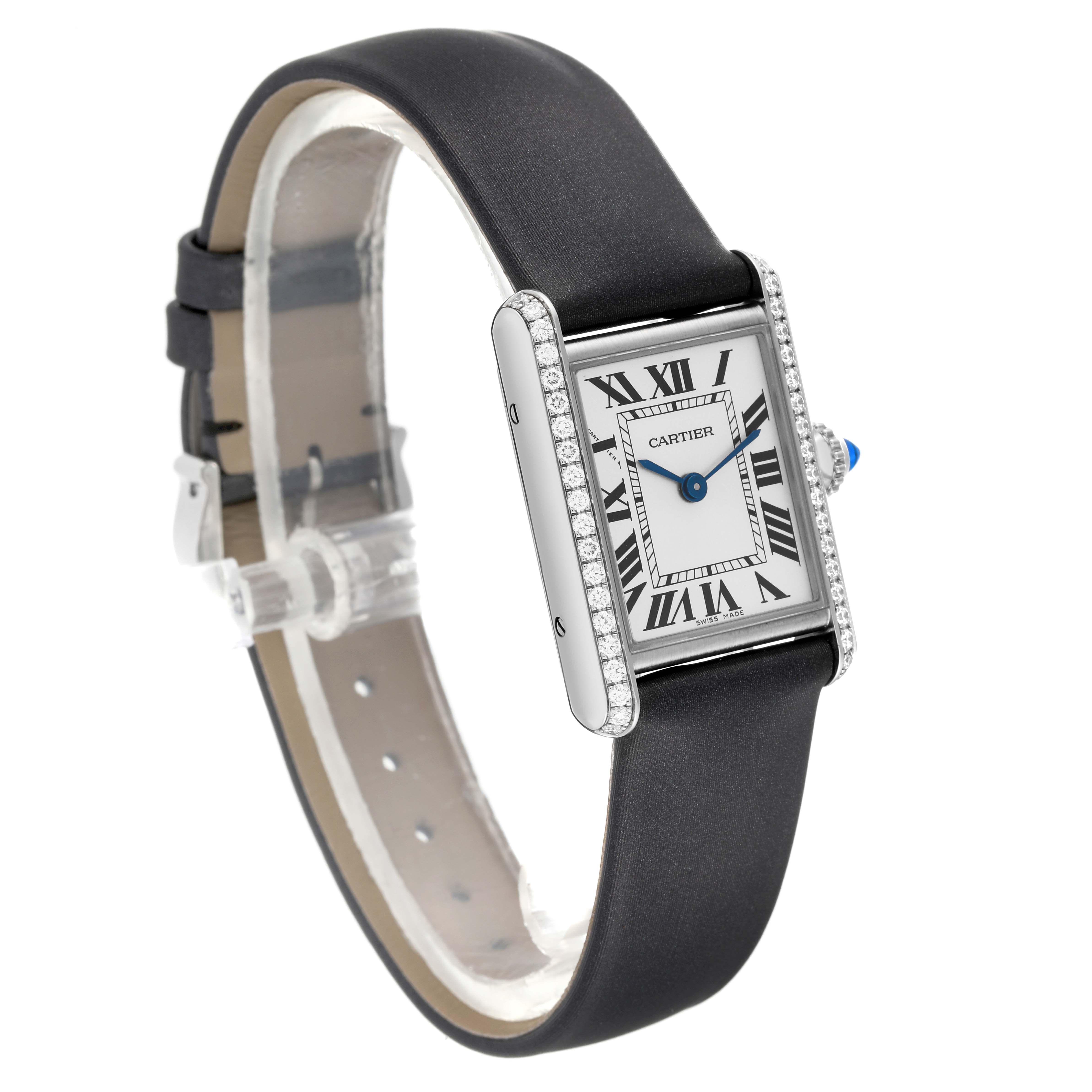 The Cartier Tank Must W4TA0016 Women's Stainless Steel Silver Dial W4TA0016 Women's Stainless Steel Silver Dial watch is shown at a slight angle, displaying its face, Roman numerals, strap, and bejeweled sides.