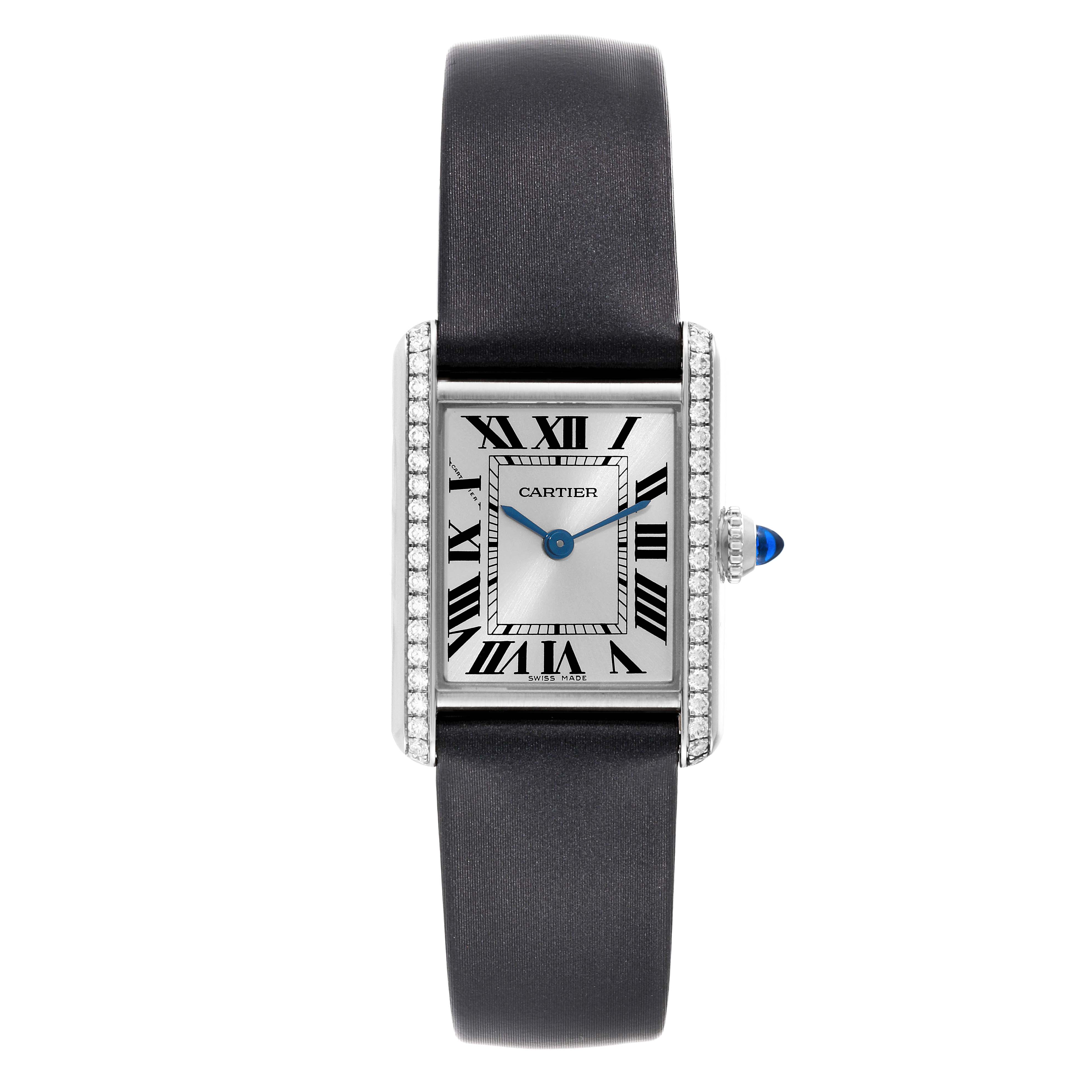 The image shows a Cartier Tank Must W4TA0016 Women's Stainless Steel Silver Dial W4TA0016 Women's Stainless Steel Silver Dial model watch from a straight-on angle, highlighting its rectangular dial, Roman numerals, and black strap.