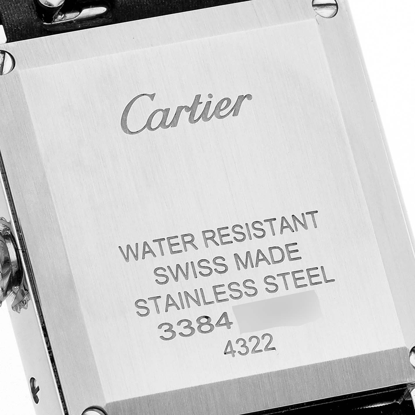 This image shows the back case of a Cartier Tank Must W4TA0016 Women's Stainless Steel Silver Dial W4TA0016 Women's Stainless Steel Silver Dial watch, displaying its inscriptions and water resistance information.