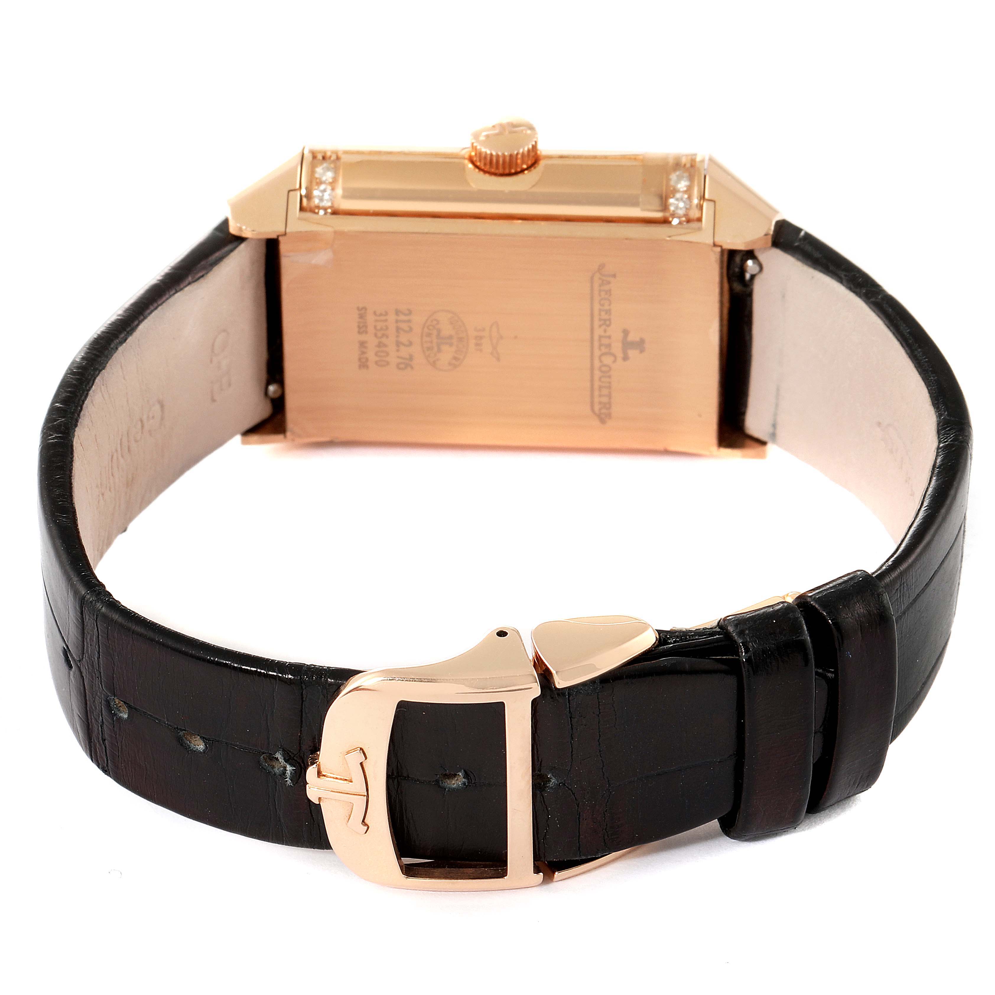 The image shows the back and side of the Reverso model by Jaeger LeCoultre, highlighting the watch case, strap, and buckle.