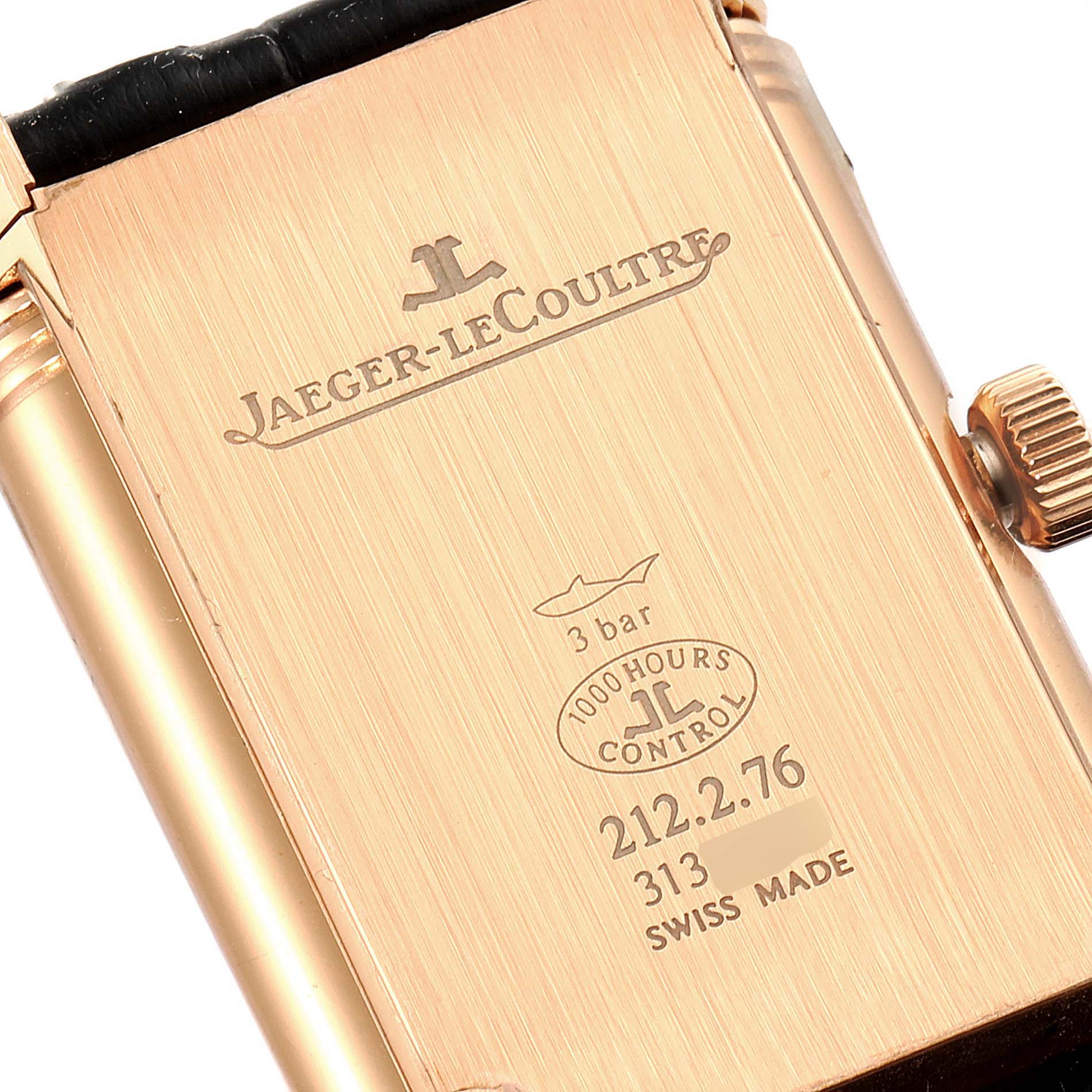 This image shows the back case and crown of a Jaeger-LeCoultre Reverso watch.