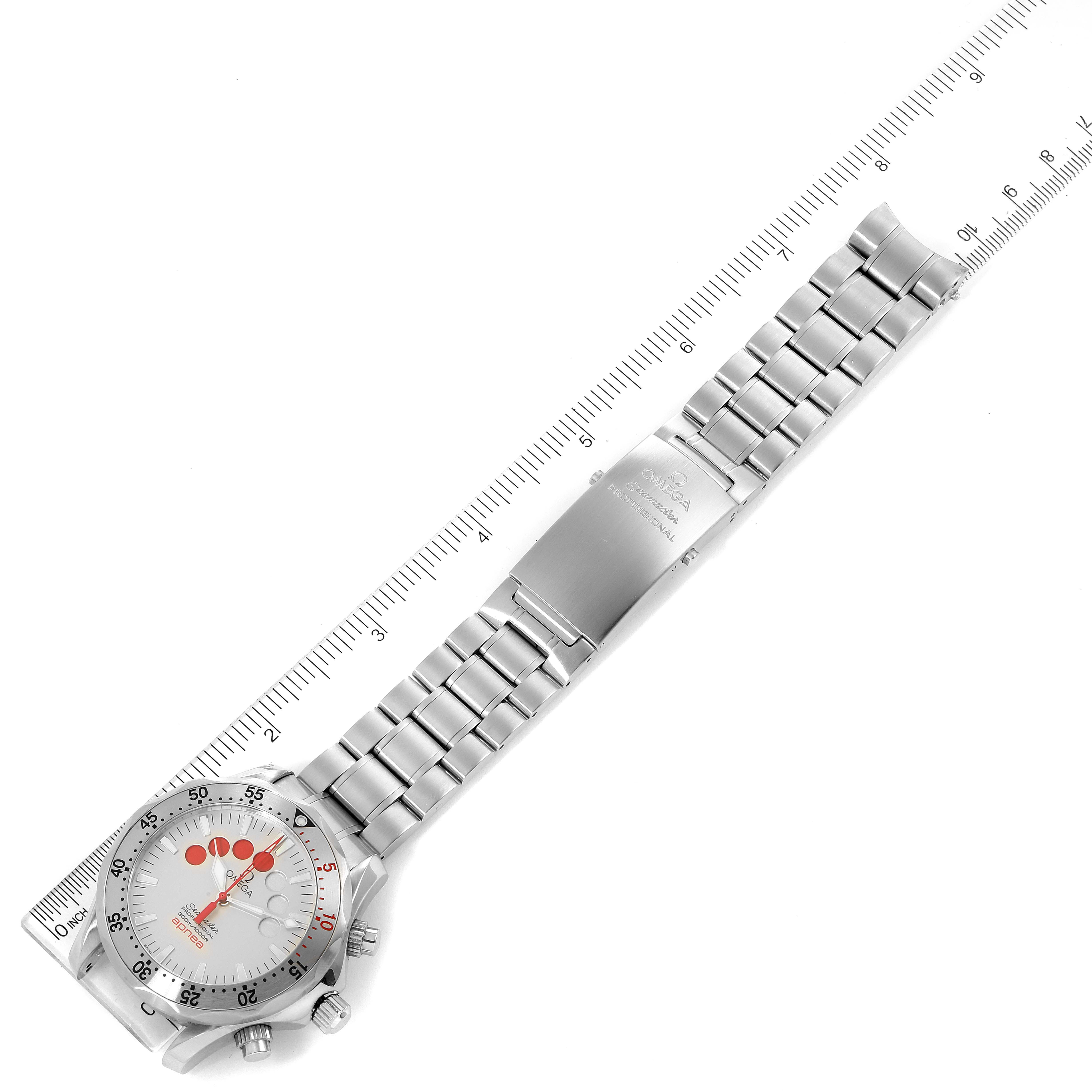 The Omega Seamaster 2595.30.00 Men
s Stainless Steel Silver Dial 2595.30.00 Men
s Stainless Steel Silver Dial watch is shown from a top-down angle, including the face, bracelet, and clasp, next to a ruler for scale.