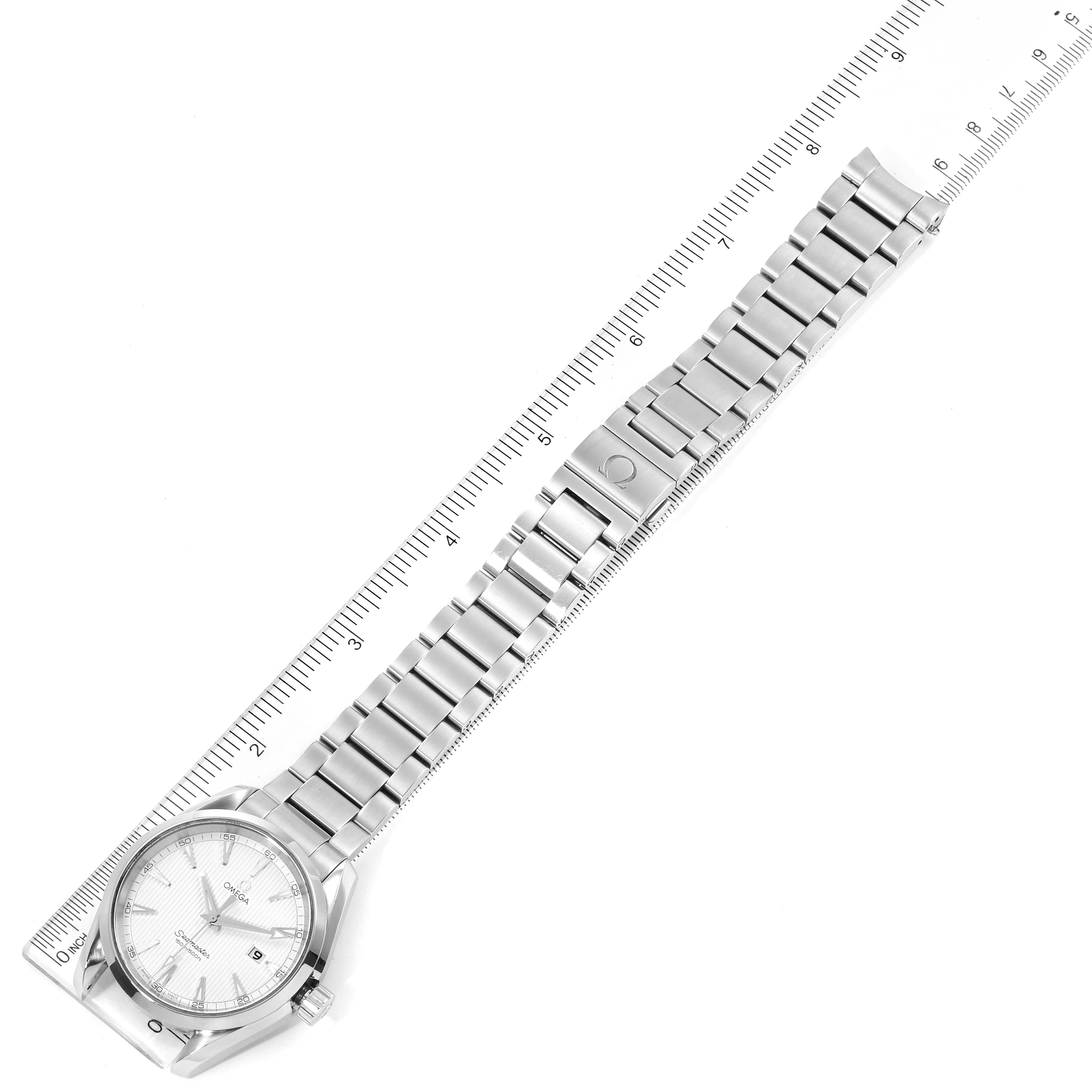 The image shows an overhead view of the Omega Aqua Terra 231.10.39.61.02.001 Men
s Stainless Steel Silver Dial 231.10.39.61.02.001 Men
s Stainless Steel Silver Dial watch with its face, bezel, bracelet, and a measuring ruler.