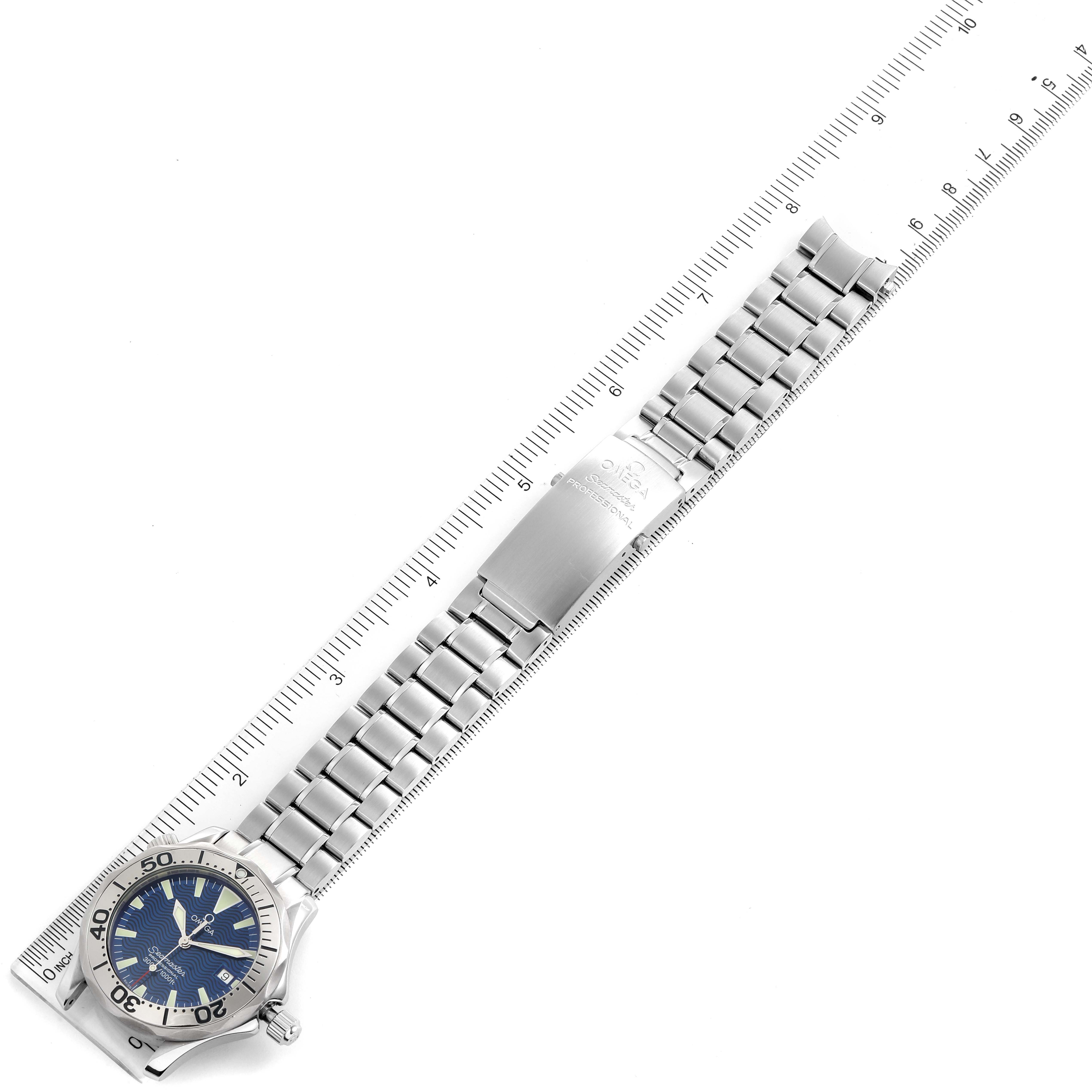 The image shows an Omega Seamaster 2263.80.00 Men
s Stainless Steel Blue Dial 2263.80.00 Men
s Stainless Steel Blue Dial watch laid flat alongside a ruler, displaying the face, bezel, and band in detail.