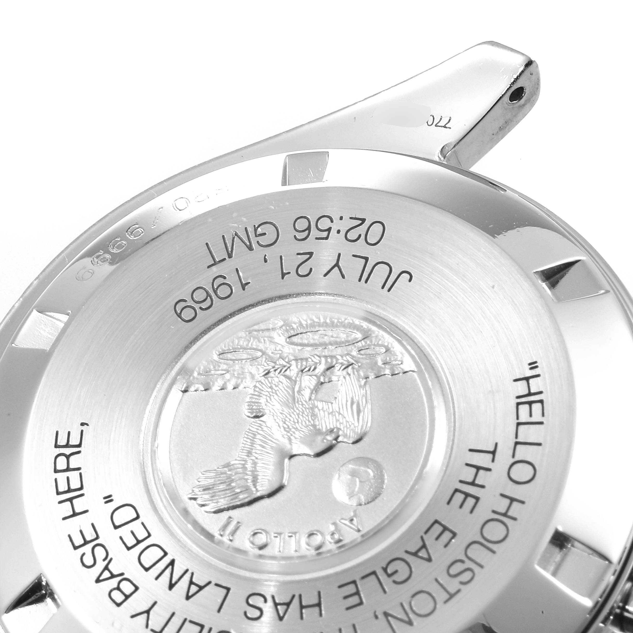 The image shows the back case of an Omega Speedmaster 3560.50.00 Men
s Stainless Steel Black Dial 3560.50.00 Men
s Stainless Steel Black Dial watch featuring the Apollo 11 mission engraving.