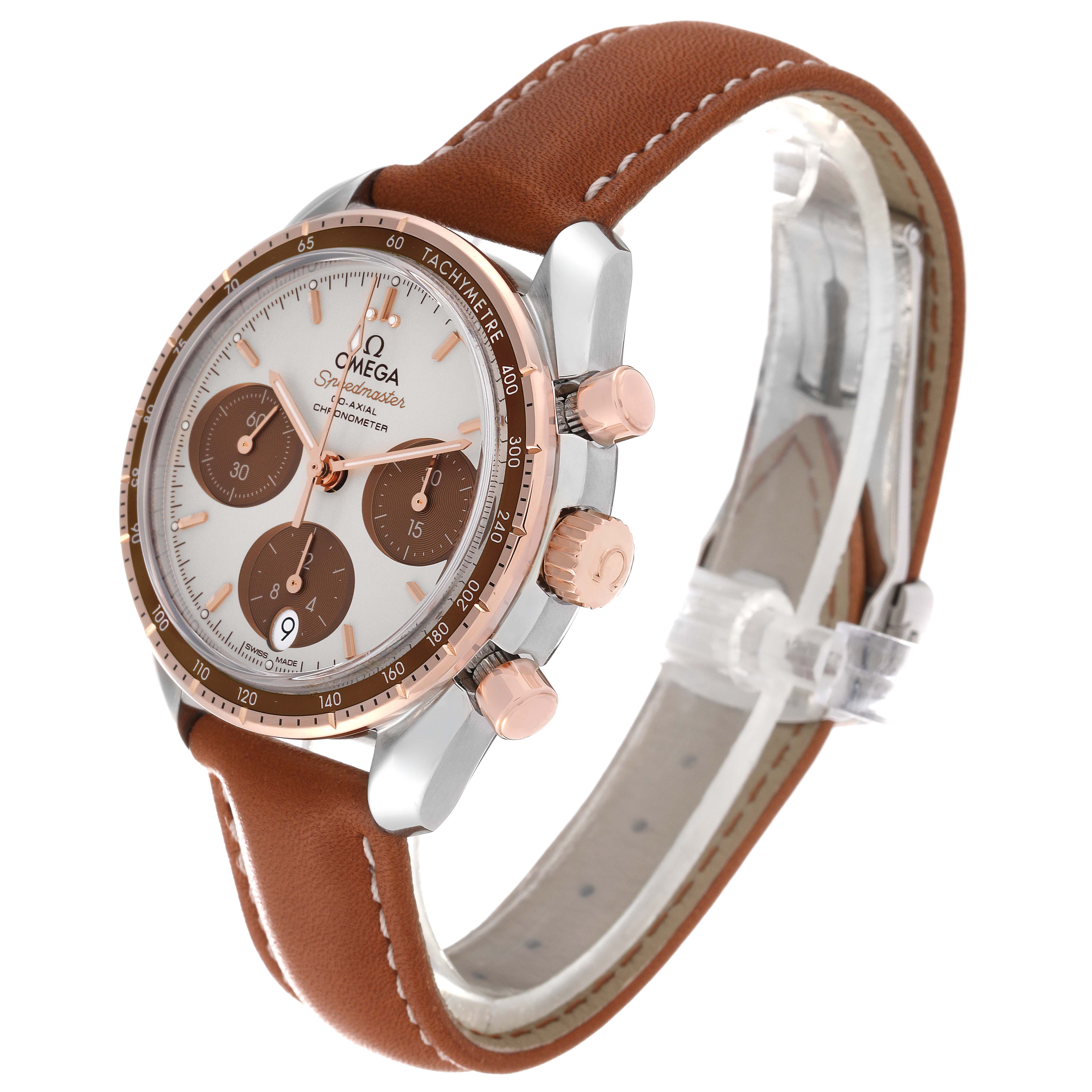 The Omega Speedmaster 324.23.38.50.02.002 Men's Steel and Gold (two tone) Silver Dial 324.23.38.50.02.002 Men's Steel and Gold (two tone) Silver Dial watch is shown at a three-quarter angle, displaying the dial, bezel, chronograph subdials, and leather strap.