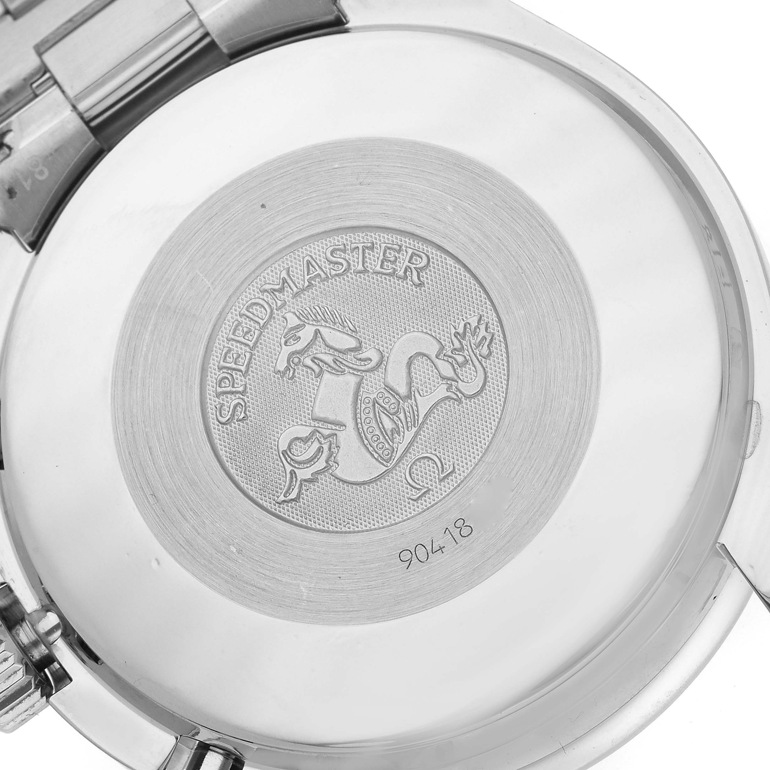 This image shows the case back of an Omega Speedmaster 3510.50.00 Men
s Stainless Steel Black Dial 3510.50.00 Men
s Stainless Steel Black Dial watch, featuring engraved details and a portion of the bracelet.