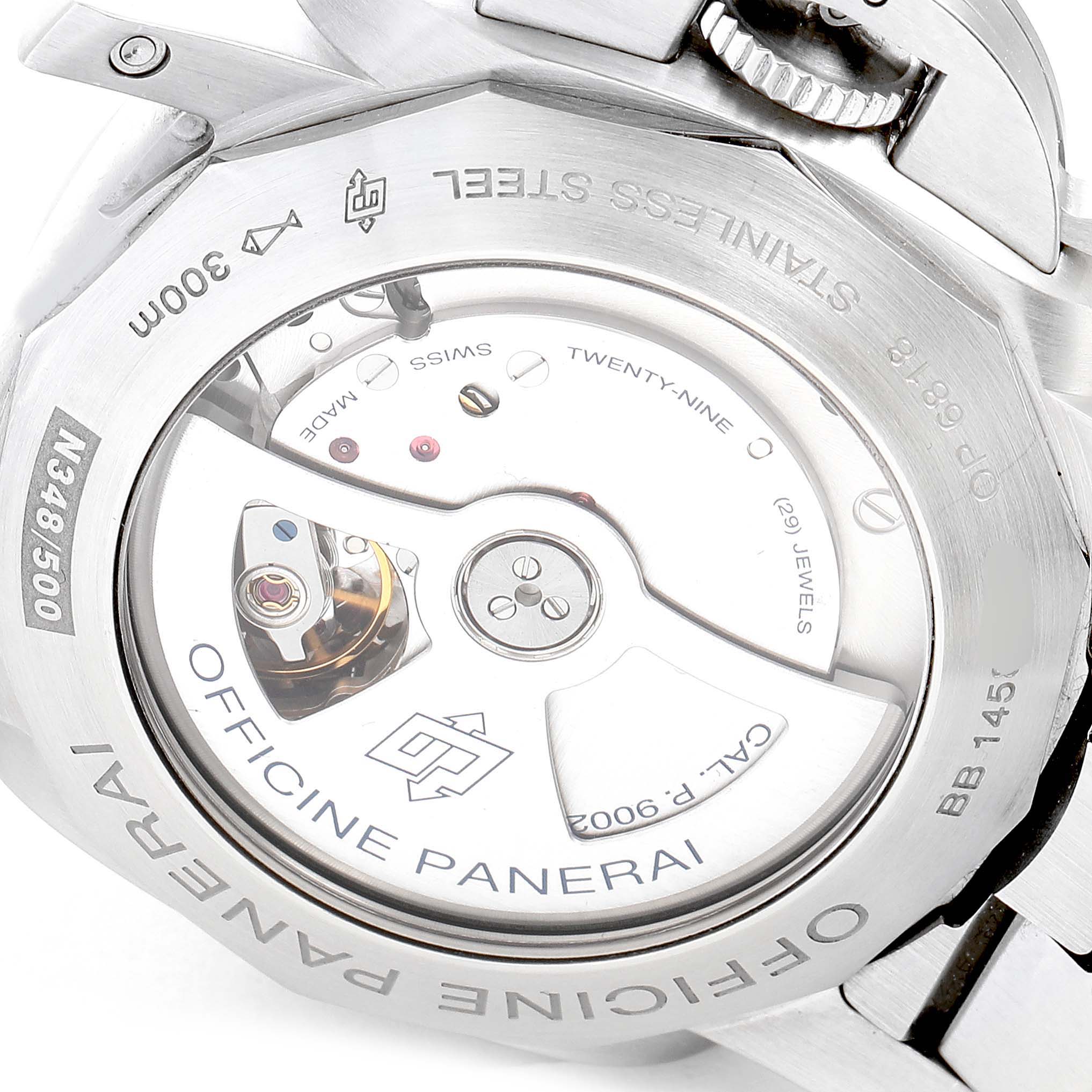 The image shows the back of a Panerai Luminor PAM00347 Men
s Stainless Steel Black Dial PAM00347 Men
s Stainless Steel Black Dial watch, revealing its internal movement and inscriptions.