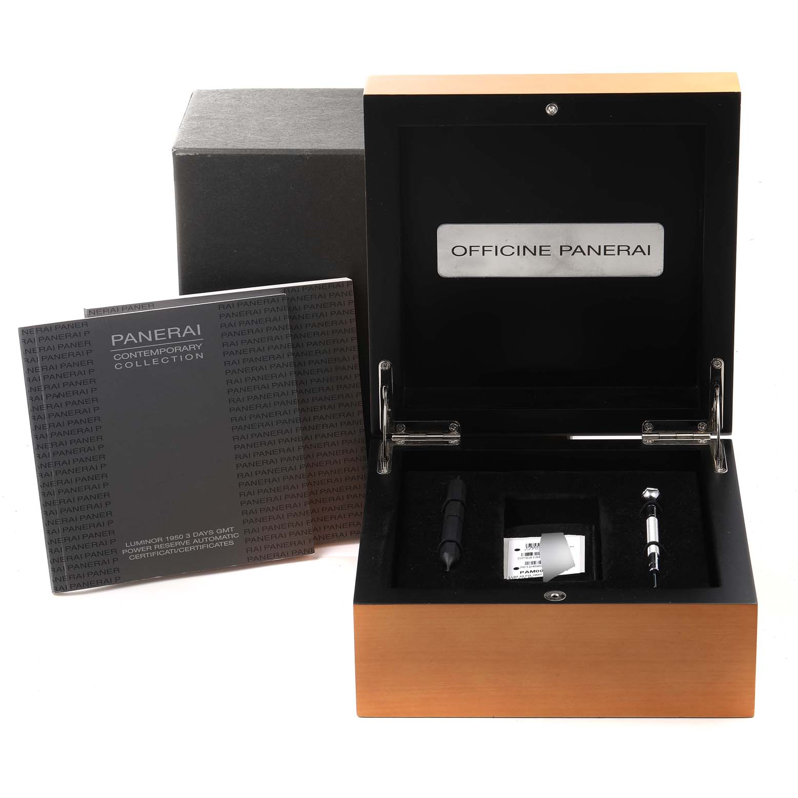 The image shows an open box of Luminor by Panerai with accessories and a booklet beside it, viewed from the front angle.