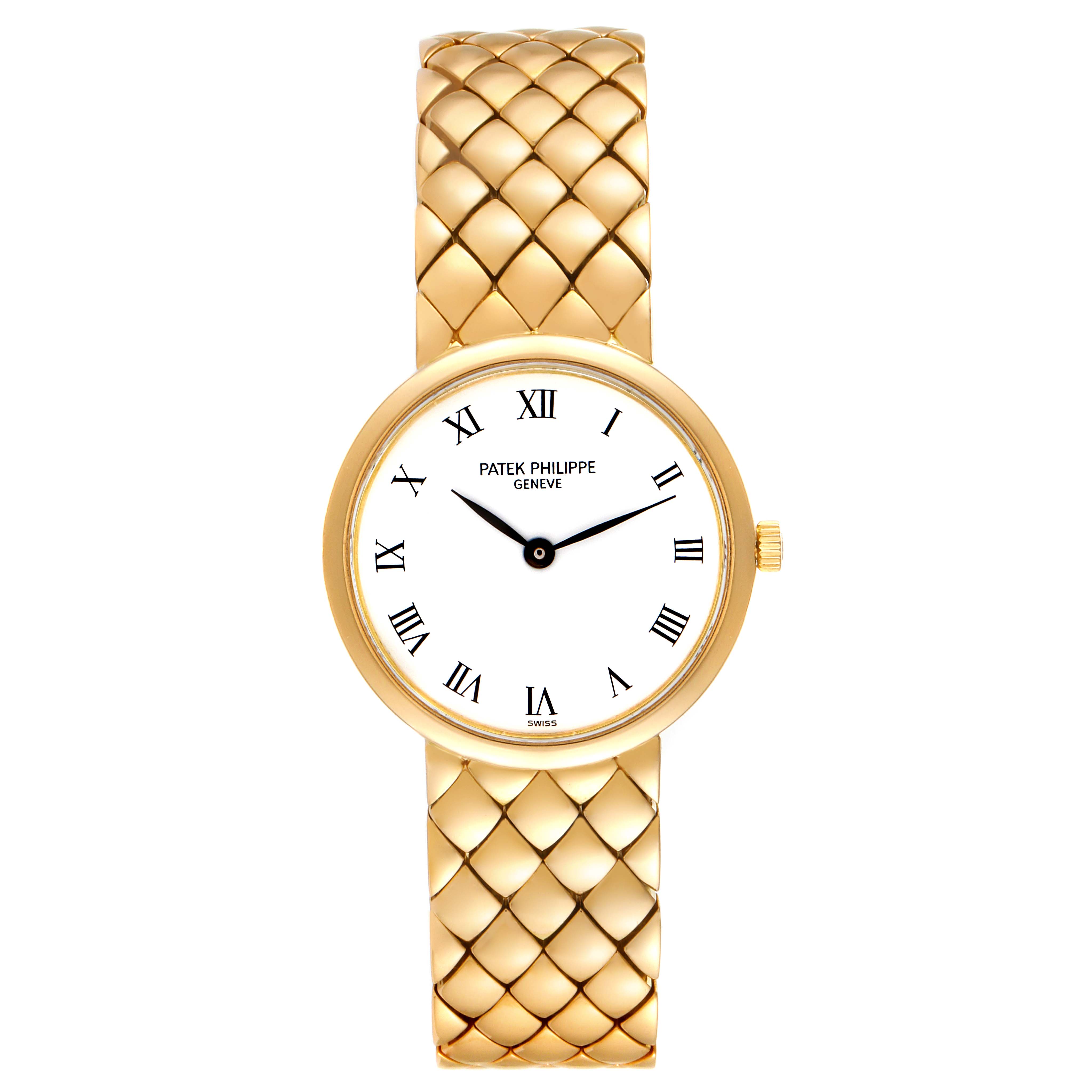 The image shows a front view of a Patek Philippe Calatrava 4821 Women's Yellow Gold White Dial 4821 Women's Yellow Gold White Dial watch, highlighting its gold case, white dial, Roman numerals, and intricately patterned gold band.