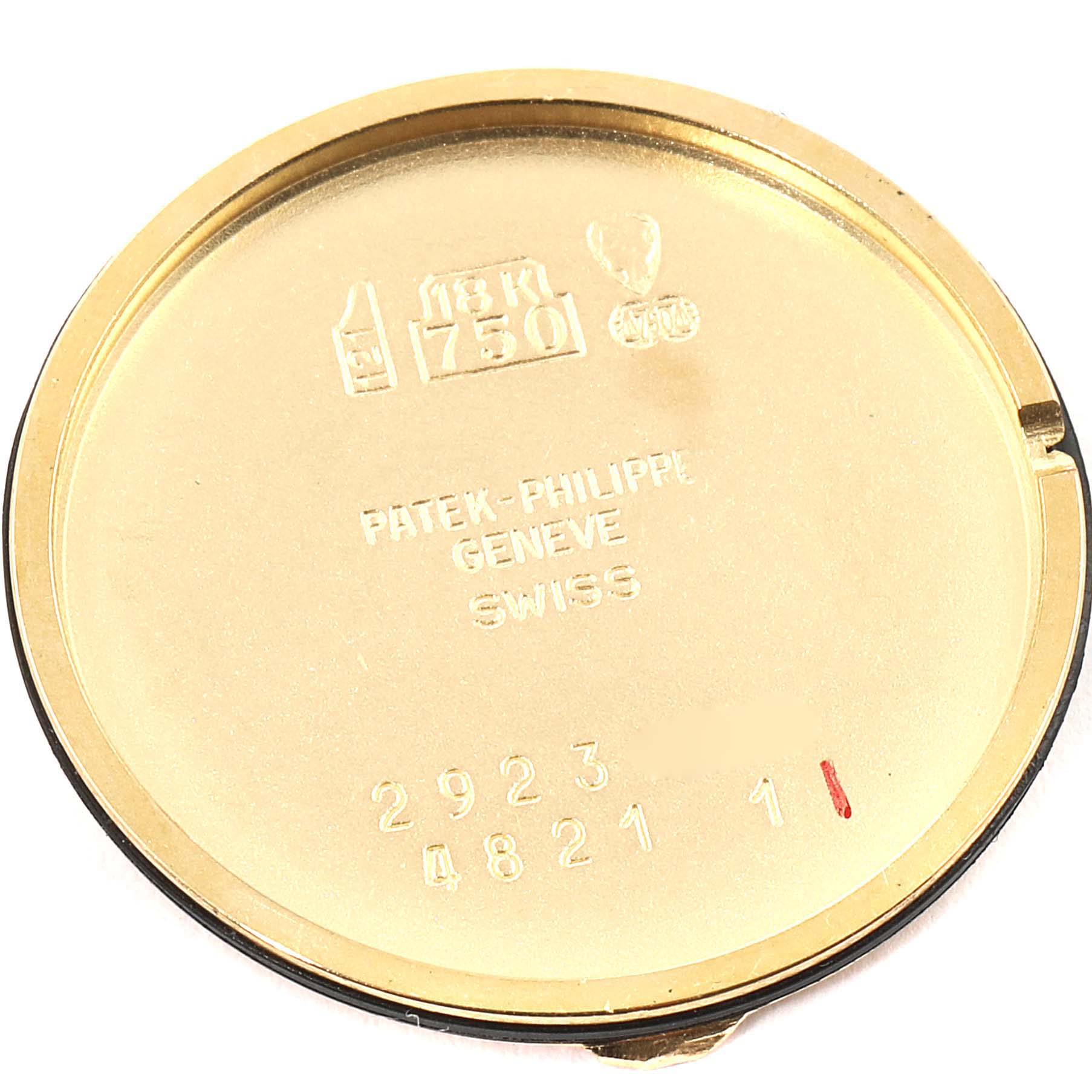 This image shows the inside case back of a Patek Philippe Calatrava 4821 Women's Yellow Gold White Dial 4821 Women's Yellow Gold White Dial watch, featuring brand engravings and gold markings.