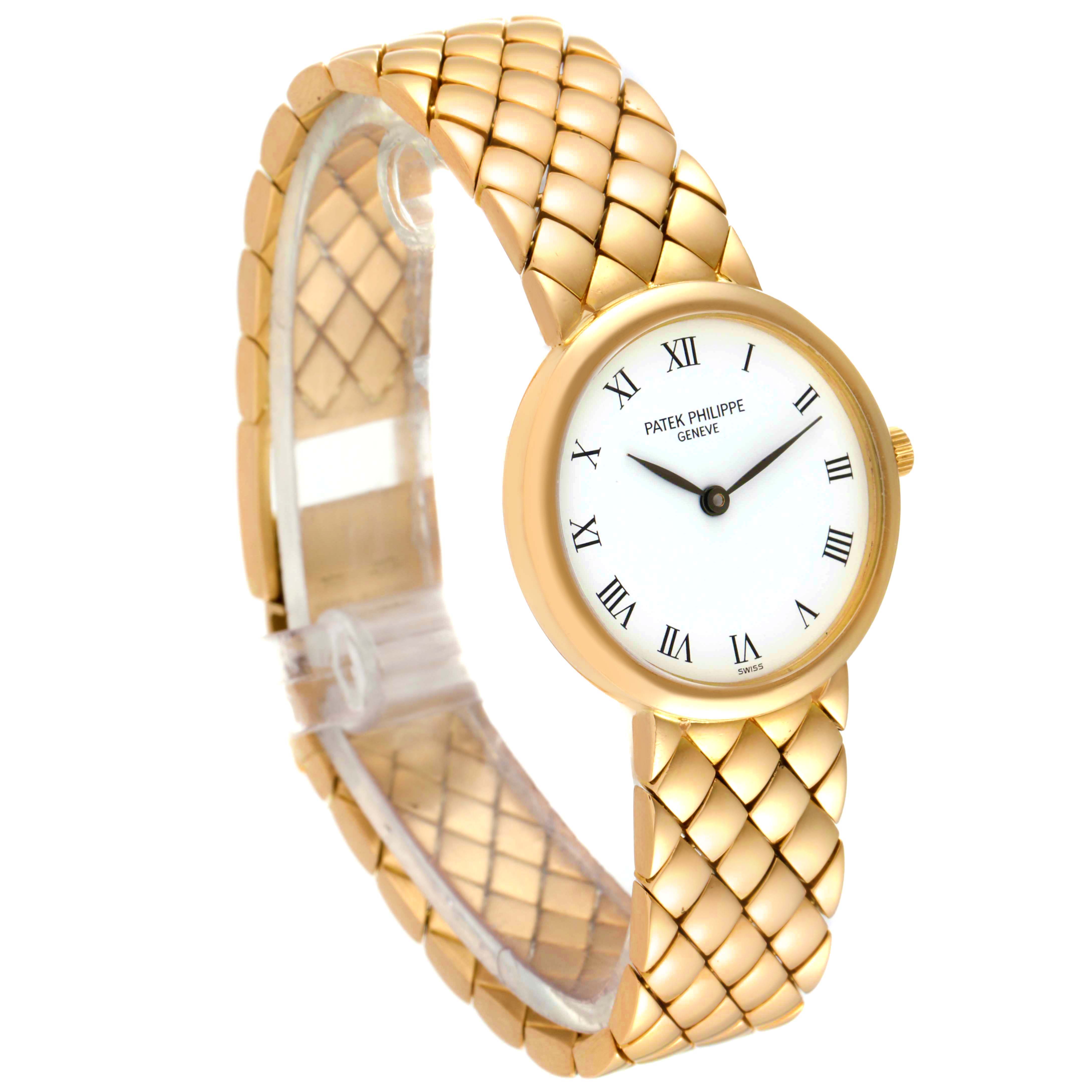 The image shows a side angle of a Patek Philippe Calatrava 4821 Women's Yellow Gold White Dial 4821 Women's Yellow Gold White Dial watch, highlighting its round dial and gold-tone bracelet.