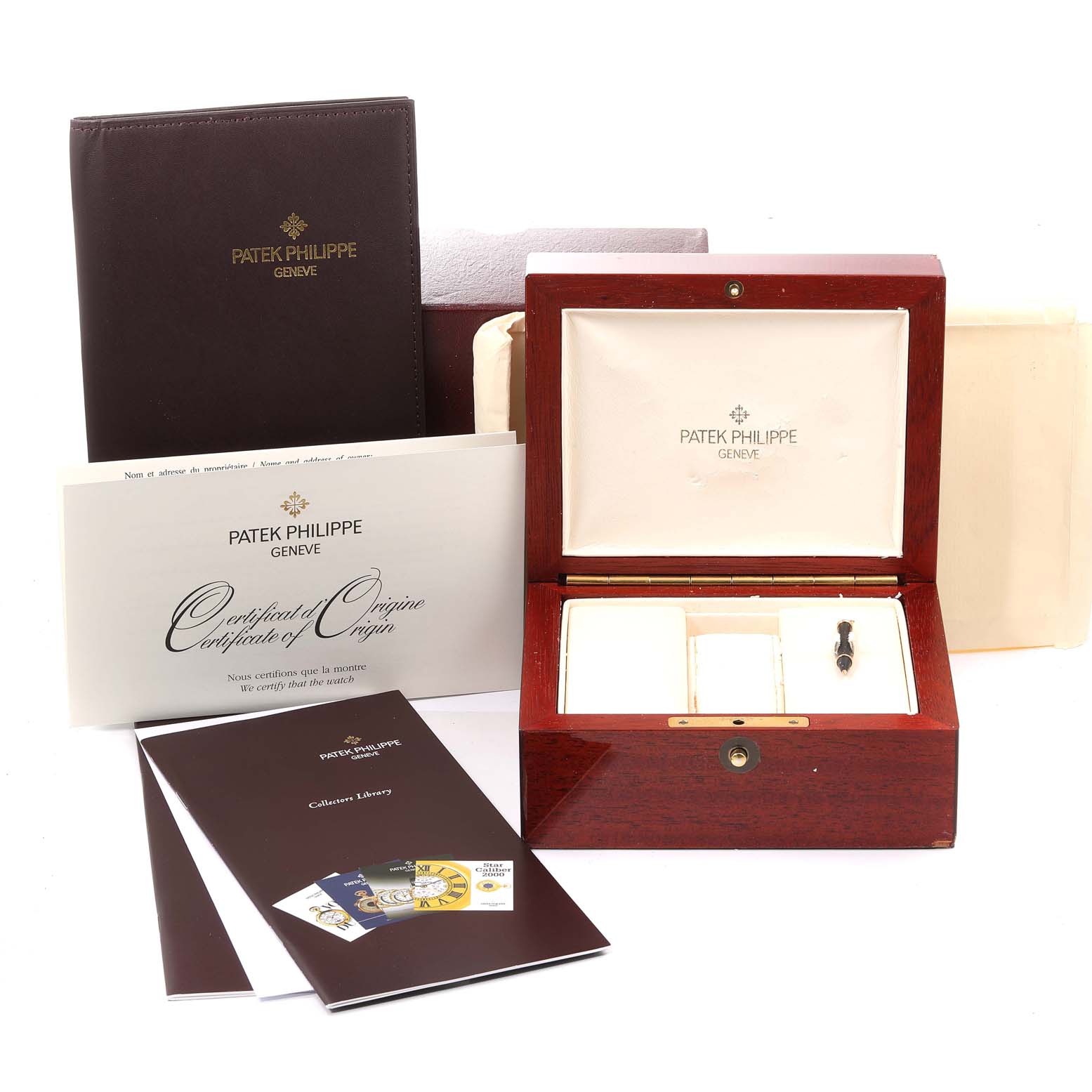 The image shows the packaging and documentation for the Patek Philippe 5146J - 01D Men
s Yellow Gold Grey Dial 5146J - 01D Men
s Yellow Gold Grey Dial Complicated Annual Calendar Yellow Gold Men
s Watch Model 5146.