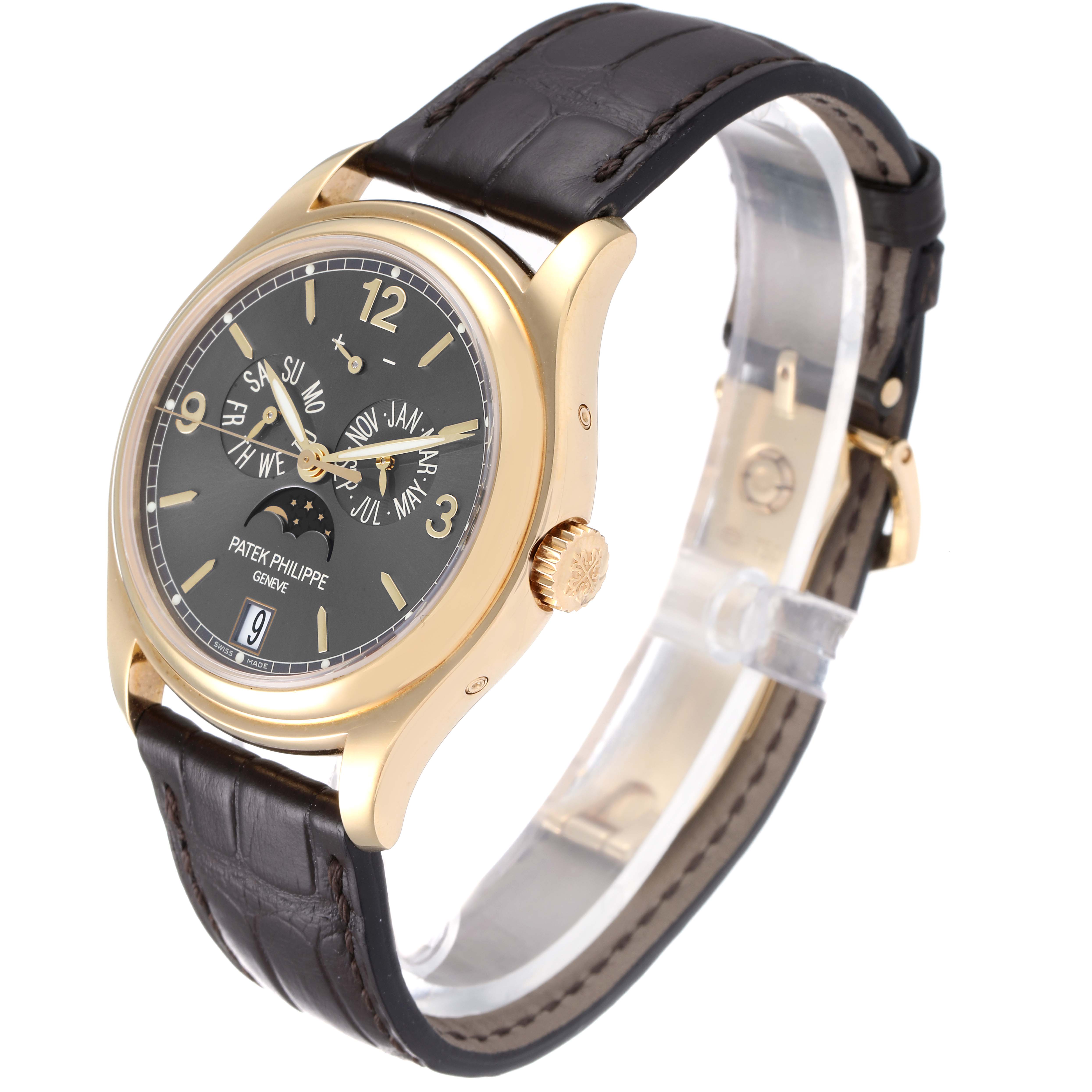 The image shows a Patek Philippe 5146J - 01D Men
s Yellow Gold Grey Dial 5146J - 01D Men
s Yellow Gold Grey Dial Complicated Annual Calendar Yellow Gold Men
s Watch 5146, angled to display the face, crown, and strap.