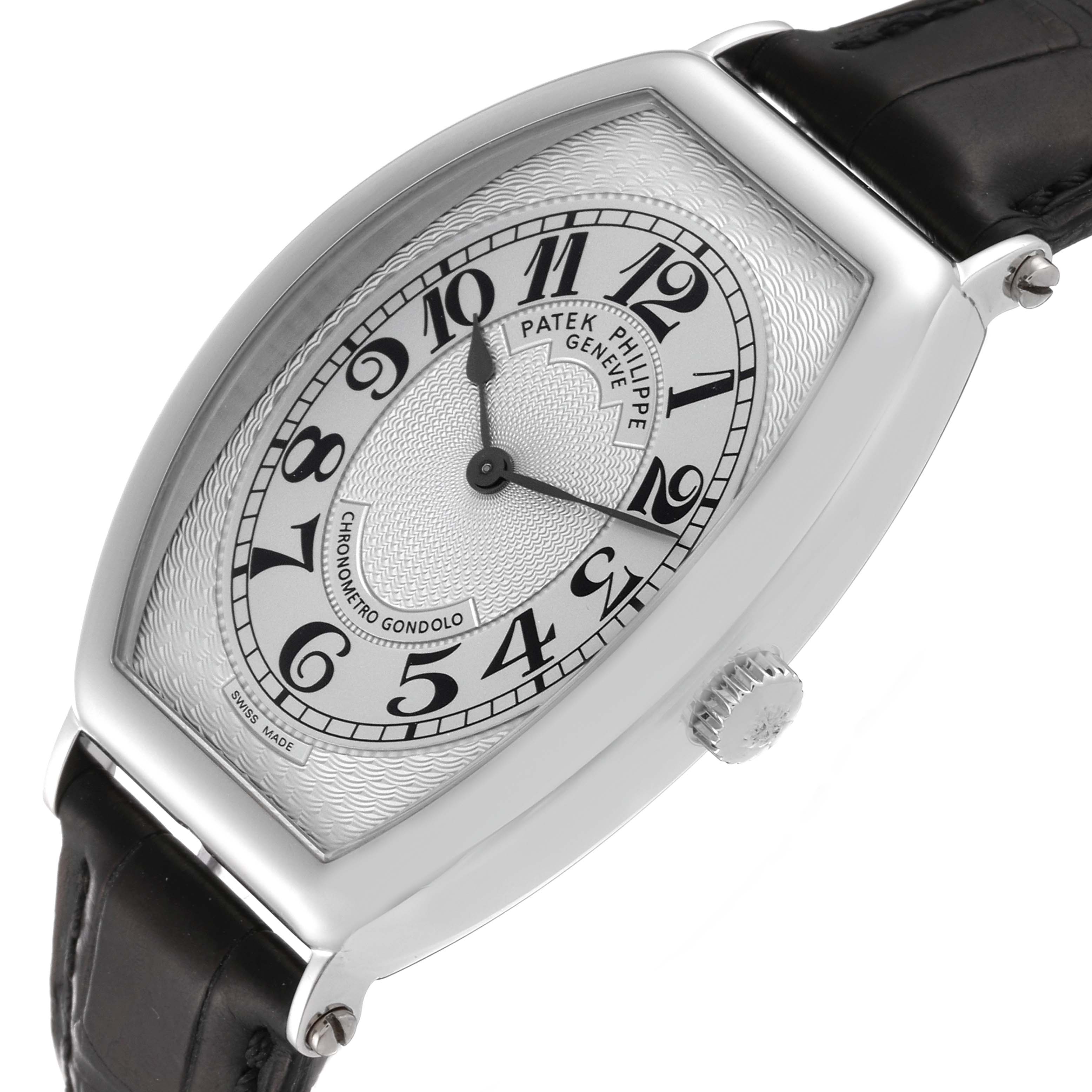 The image shows a Patek Philippe Gondolo 5098P Men's Platinum Silver Dial 5098P Men's Platinum Silver Dial watch from an angle that highlights the face, crown, and part of the leather strap.