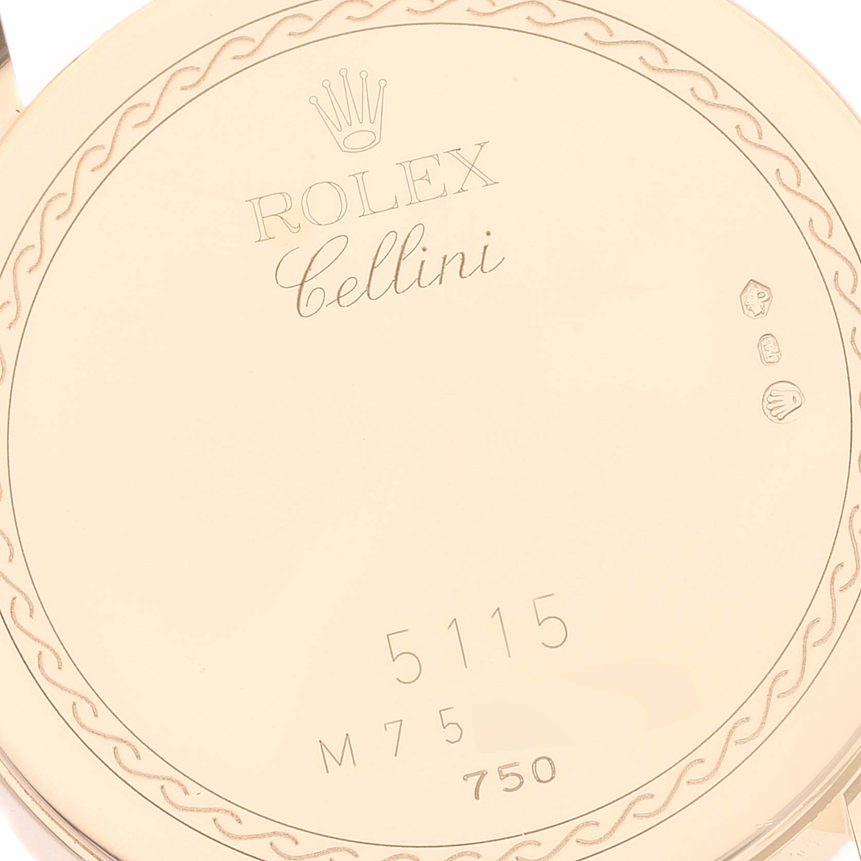 This image shows the engraved case back of a Rolex Cellini 5115 Men's Yellow Gold Mother of Pearl Dial 5115 Men's Yellow Gold Mother of Pearl Dial model with inscriptions and decorative details.