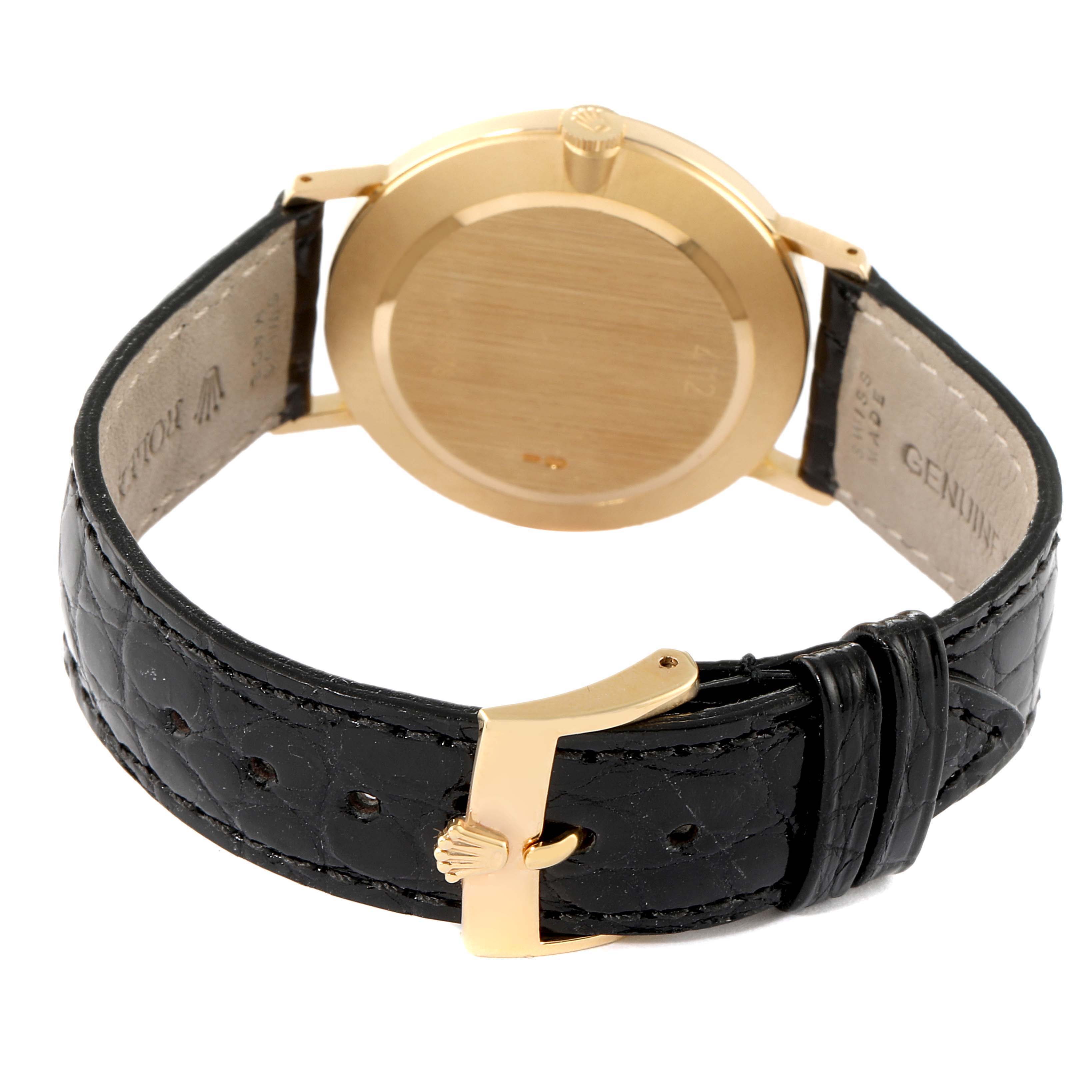 The image shows a rear view of a Rolex Cellini 4112 Men's Yellow Gold White Dial 4112 Men's Yellow Gold White Dial watch, highlighting the leather strap, clasp, and the back of the case.