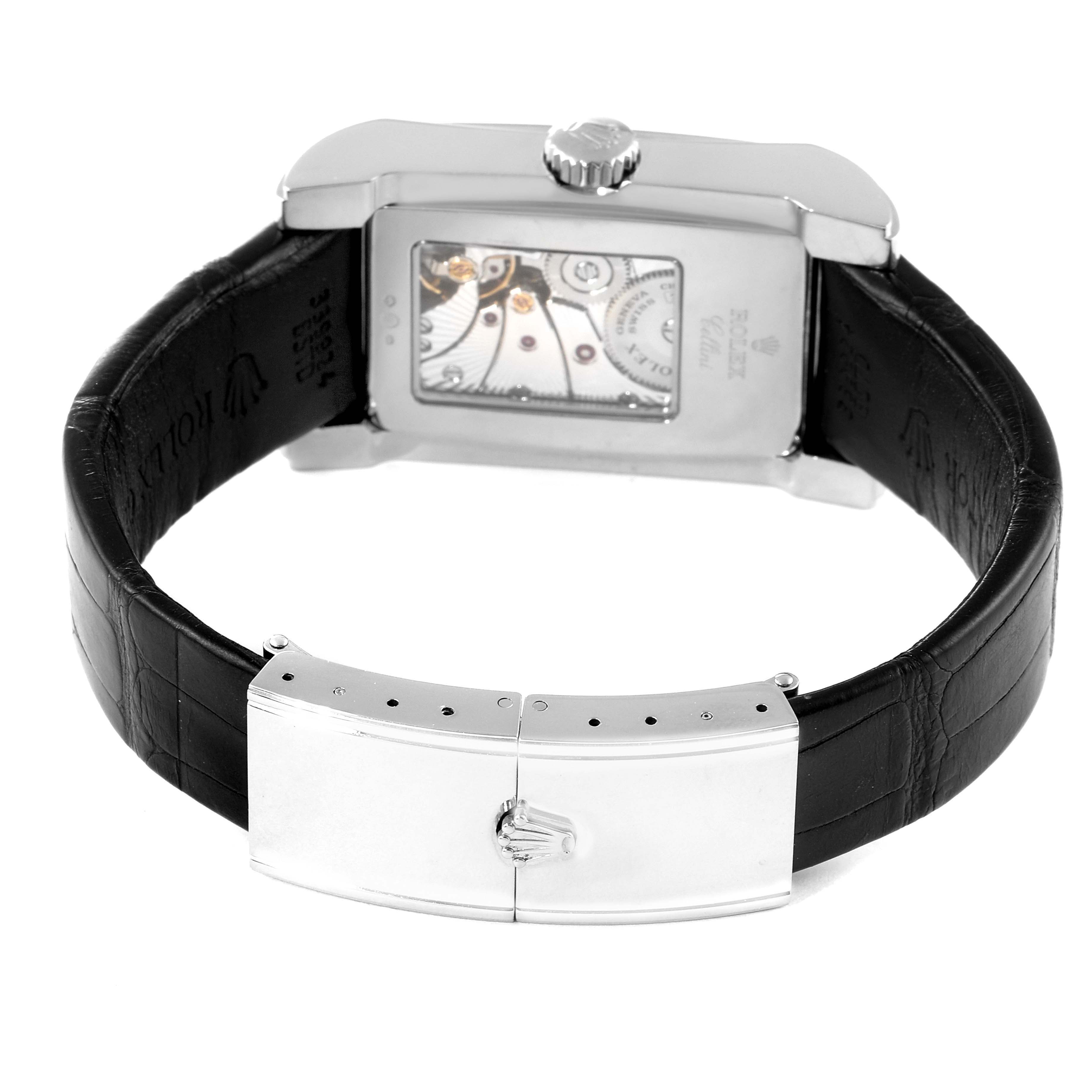 This image shows the back view of a Rolex Cellini 5443/9 Men
s White Gold Black Dial 5443/9 Men
s White Gold Black Dial watch, highlighting the movement and black leather strap with a silver clasp.