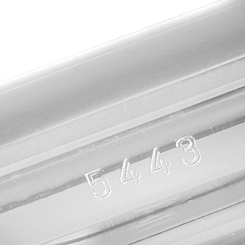 The image shows a close-up of the engraved serial number "5443" on the metal surface of a Rolex Cellini 5443/9 Men
s White Gold Black Dial 5443/9 Men
s White Gold Black Dial watch.