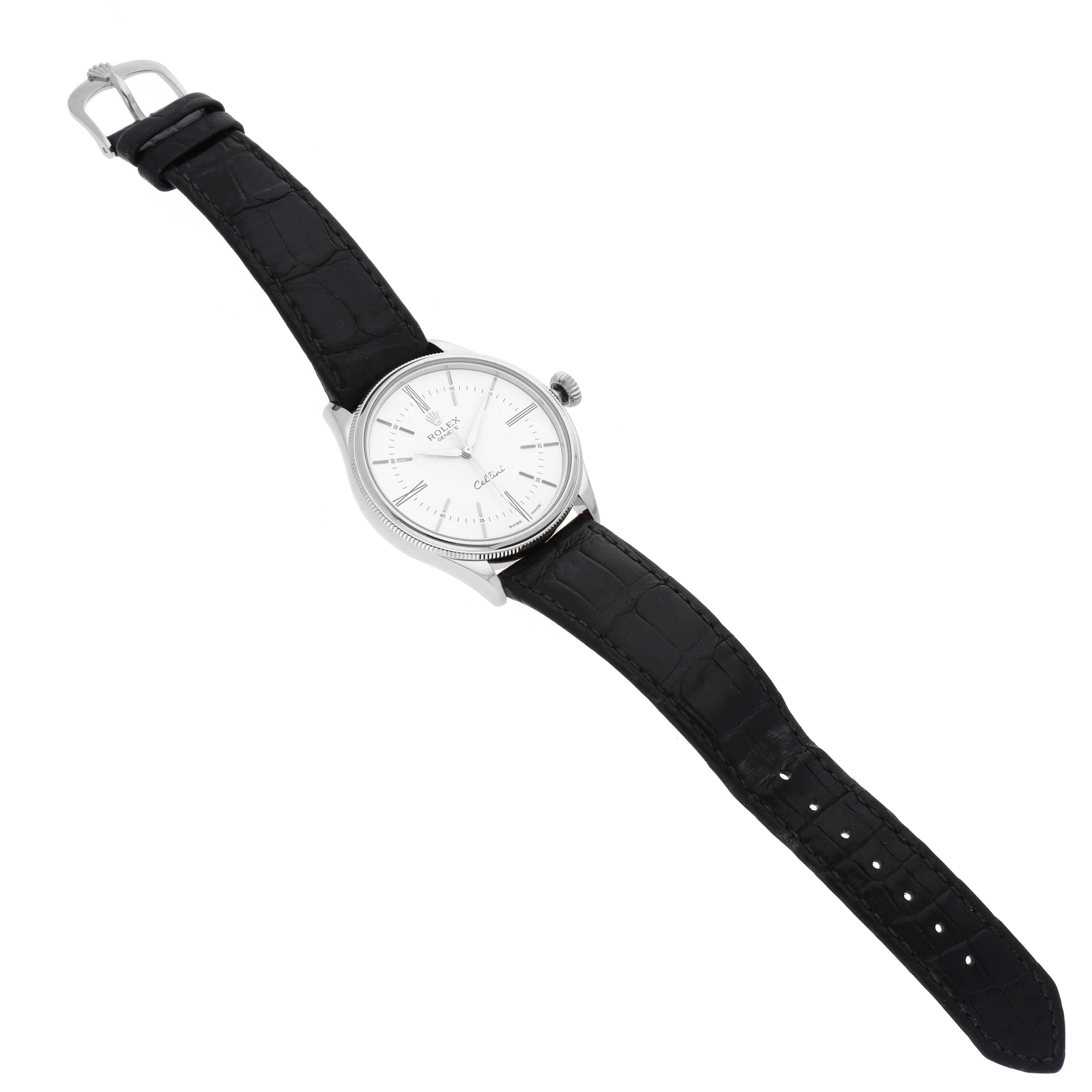 The image shows an angled top-down view of a Rolex Cellini 50509 Men's White Gold White Dial 50509 Men's White Gold White Dial watch with a black leather strap and silver watch face.