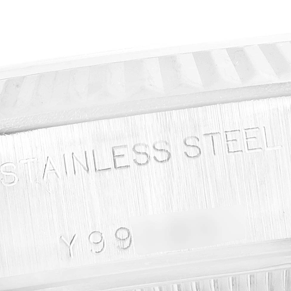 The image shows a close-up view of the stainless steel case and serial number engraving on a Rolex Datejust 79174 Women
s Stainless Steel Black Dial 79174 Women
s Stainless Steel Black Dial watch.