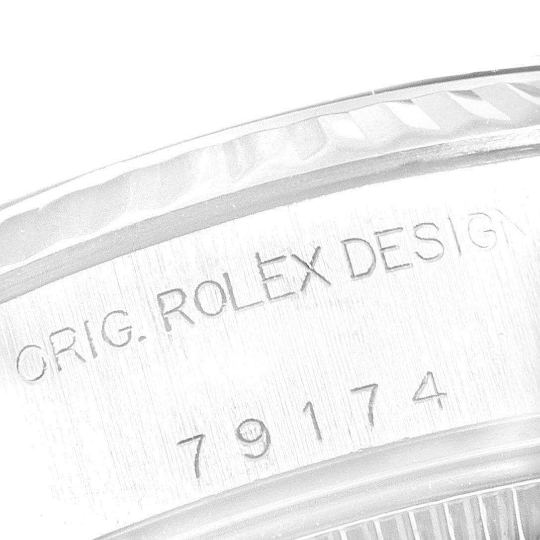 This image shows a close-up of the side of a Rolex Datejust 79174 Women
s Stainless Steel Black Dial 79174 Women
s Stainless Steel Black Dial watch, specifically focusing on the engraved model number 79174.