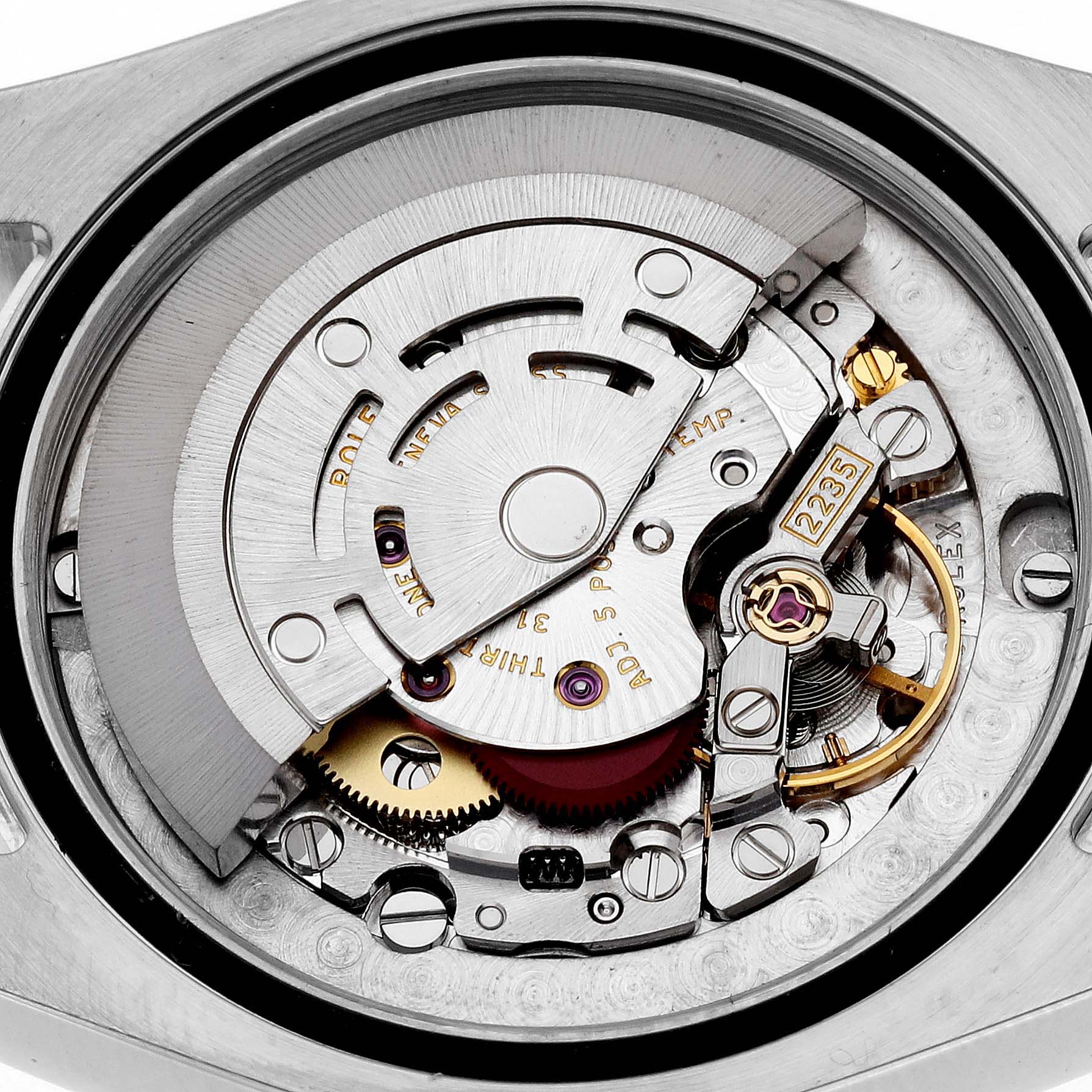The image shows the internal mechanism of a Mid-Size Rolex watch, focusing on the intricate movement components.