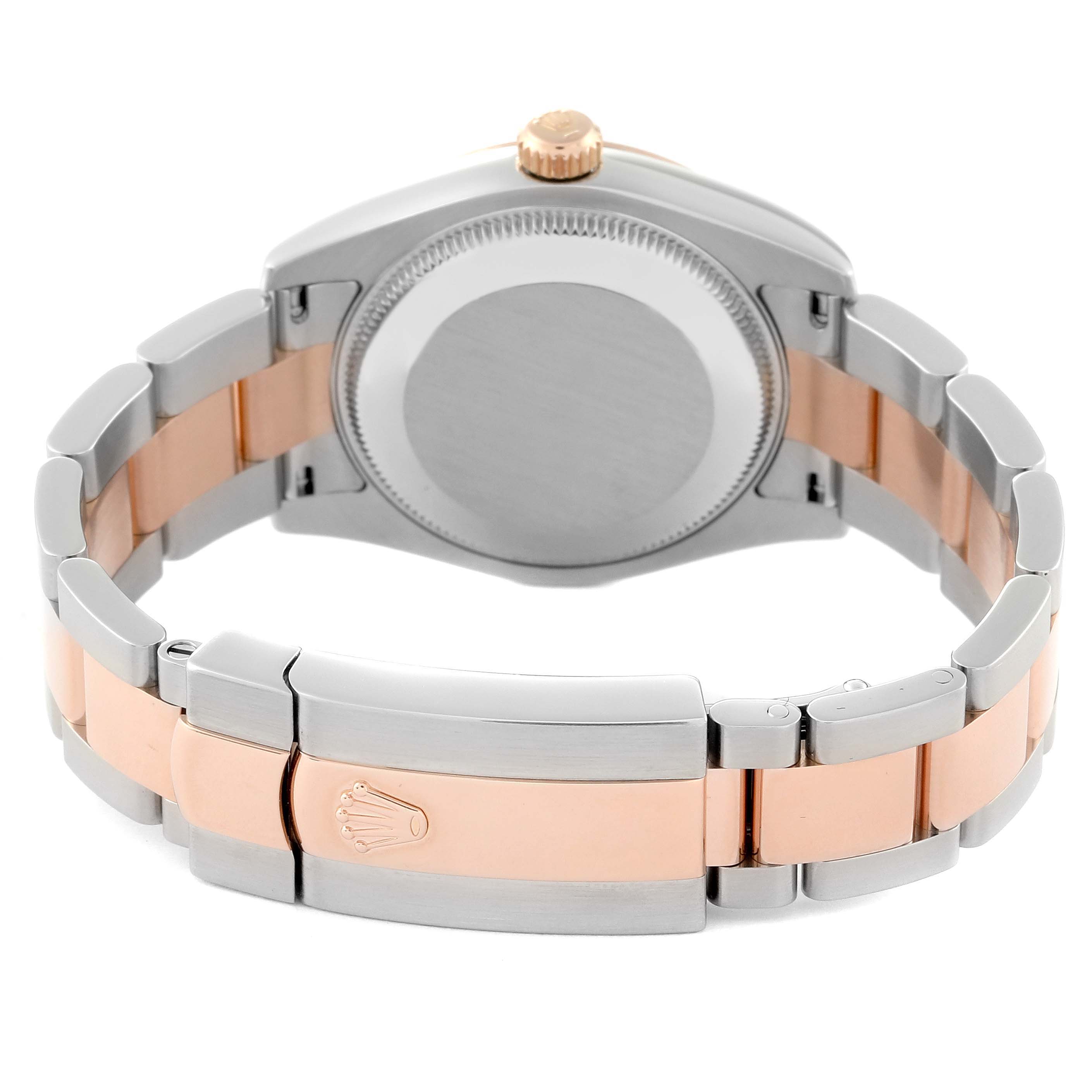 The image shows the back case and bracelet of a mid-size Rolex watch, featuring a two-tone metal design and the Rolex logo on the clasp.