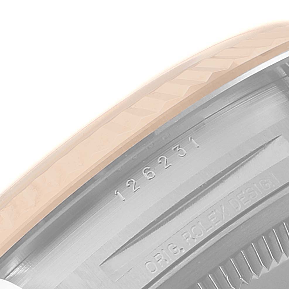This image shows a close-up of the side of the bezel and case back of a Rolex Datejust 126231 Men's Steel and Gold (two tone) White Dial 126231 Men's Steel and Gold (two tone) White Dial model, displaying the model number and "ORIG ROLEX DESIGN" inscription.