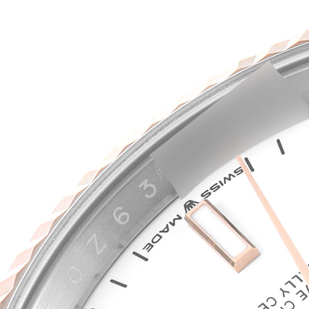 This close-up angle shows the dial, partial bezel, and rehaut of a Rolex Datejust 126231 Men's Steel and Gold (two tone) White Dial 126231 Men's Steel and Gold (two tone) White Dial watch.