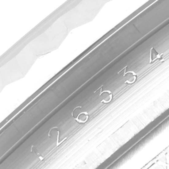 This image shows a close-up of the serial number engraving on the inner bezel of a Rolex Datejust 41 126334 Men's Stainless Steel Blue Dial 126334 Men's Stainless Steel Blue Dial watch.