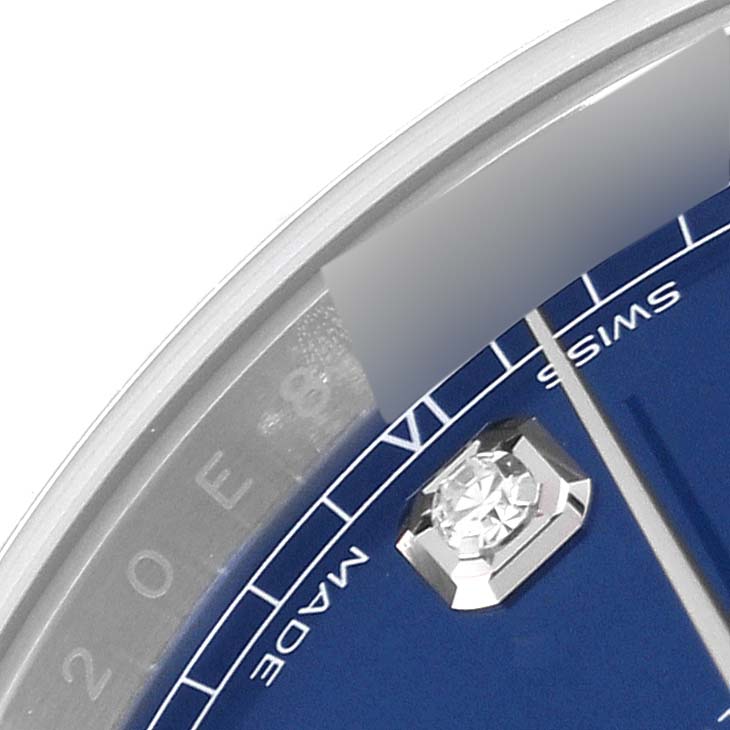 This close-up image of the Rolex Datejust 41 126334 Men's Stainless Steel Blue Dial 126334 Men's Stainless Steel Blue Dial watch highlights part of its bezel, dial, and a diamond marker.