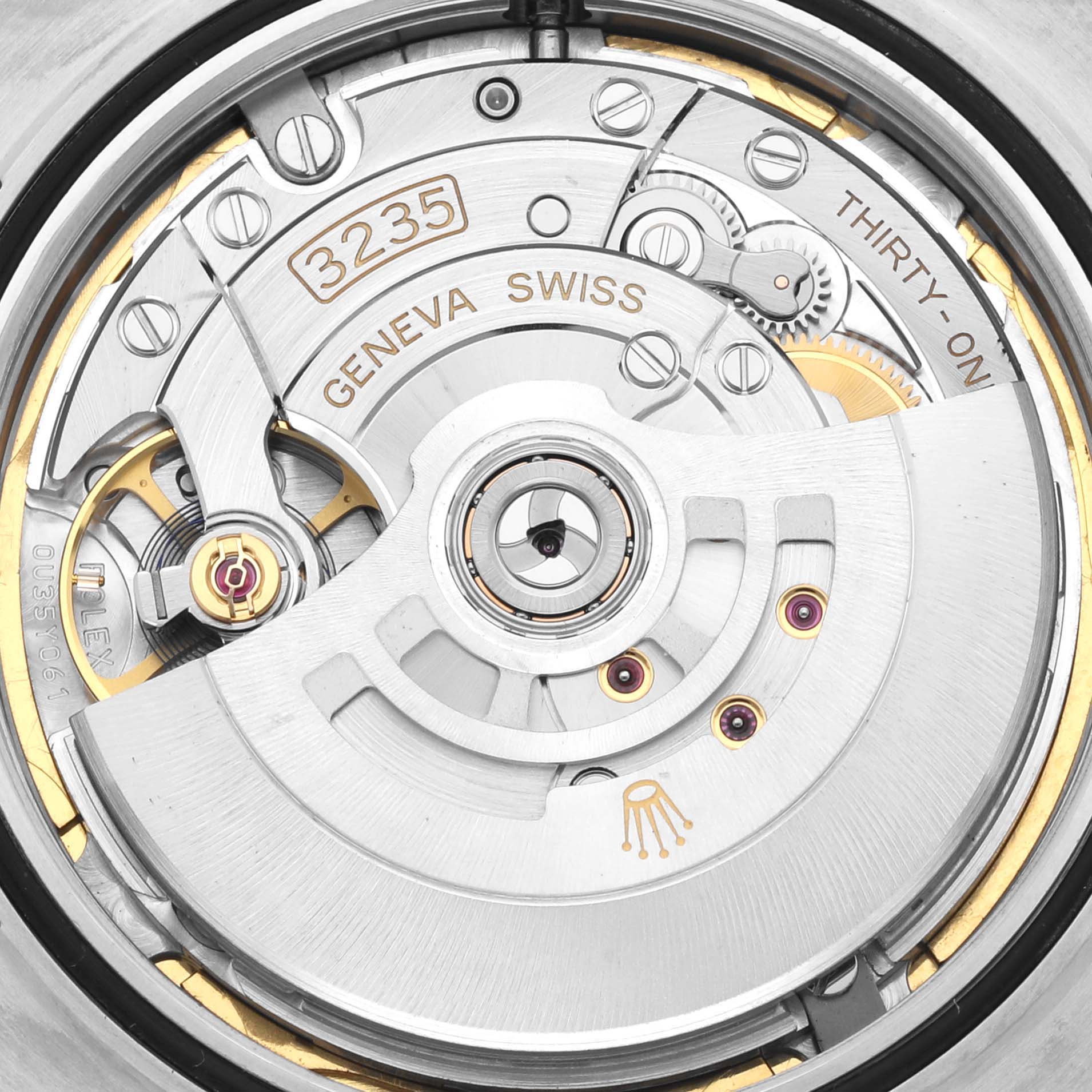 This is a close-up view of the movement inside the Rolex Datejust 41 126334 Men's Stainless Steel Blue Dial 126334 Men's Stainless Steel Blue Dial watch, showing the intricate mechanics and rotor.