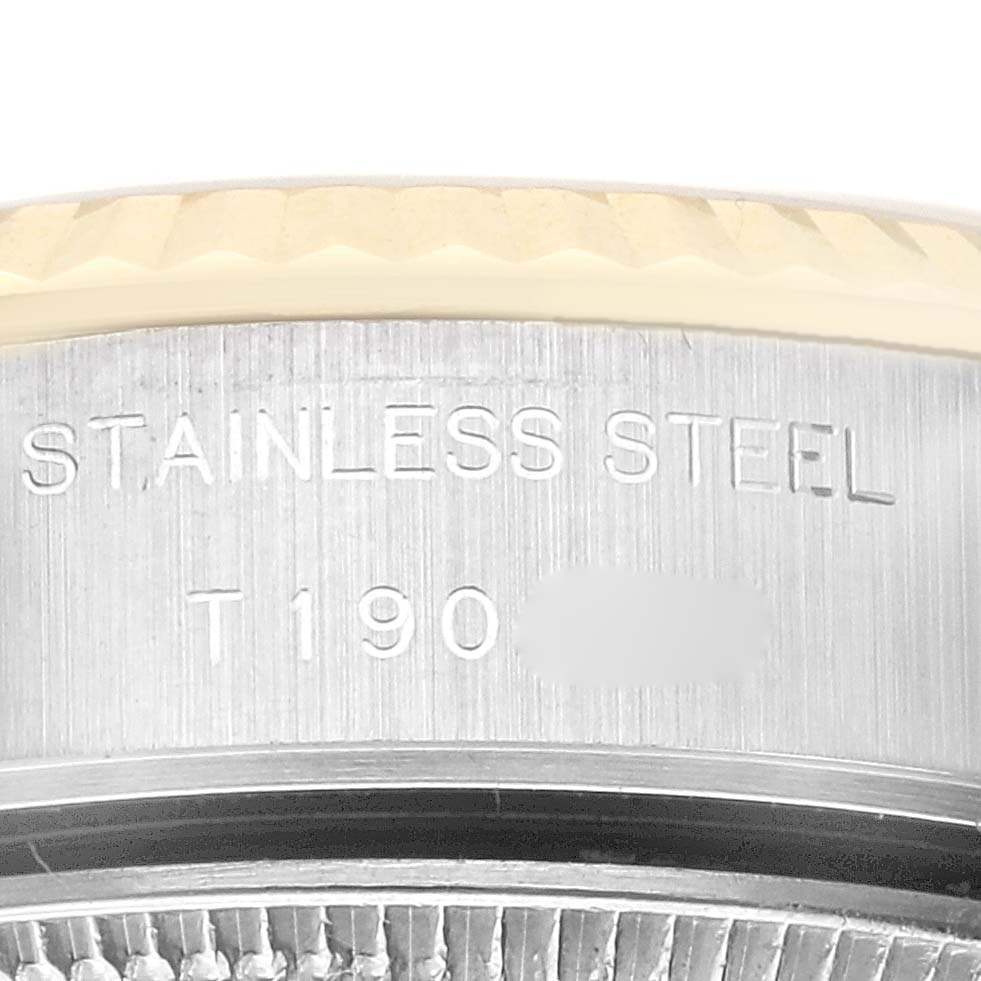This image shows a close-up of the side and bezel of a Rolex Datejust 69173 Women's Steel and Gold (two tone) Champagne Dial 69173 Women's Steel and Gold (two tone) Champagne Dial watch, highlighting the "Stainless Steel" engraving.
