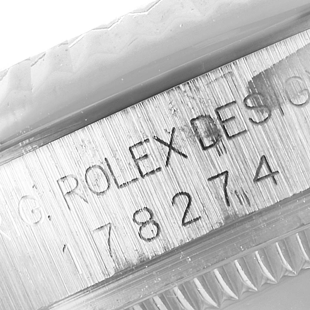 Close-up view of the engraving on the side of a Rolex Mid-Size 178274 Women's Stainless Steel Pink Dial 178274 Women's Stainless Steel Pink Dial watch, displaying the model number and "Rolex Design" text.