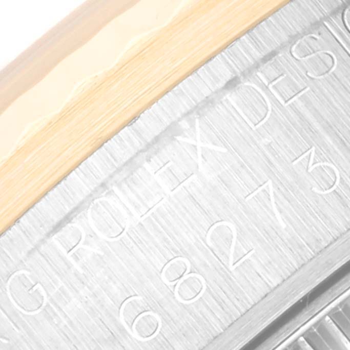 This close-up image of the Mid-Size Rolex watch shows the engraved model number and "Rolex Design" text.